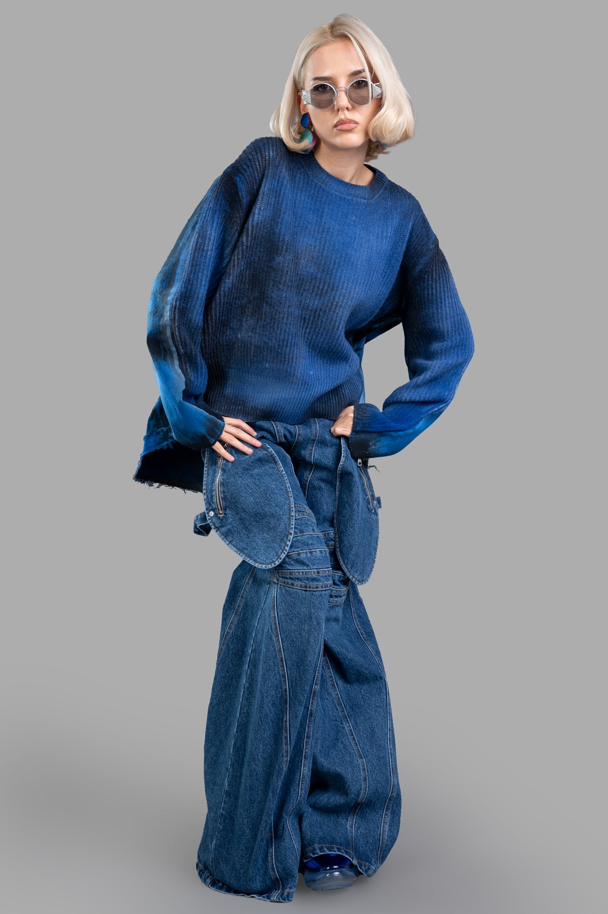 Avant Toi Faded-effect Sweater in blue, front view on-model, featuring oversized fit and asymmetric denim hem.