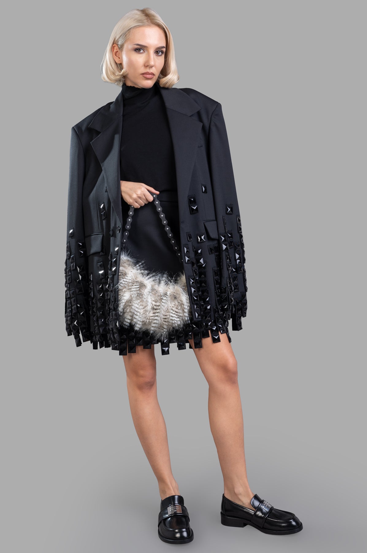 MSGM black stud-embellished skirt with bead details, high-rise fit, seen on model with matching jacket and shoes.