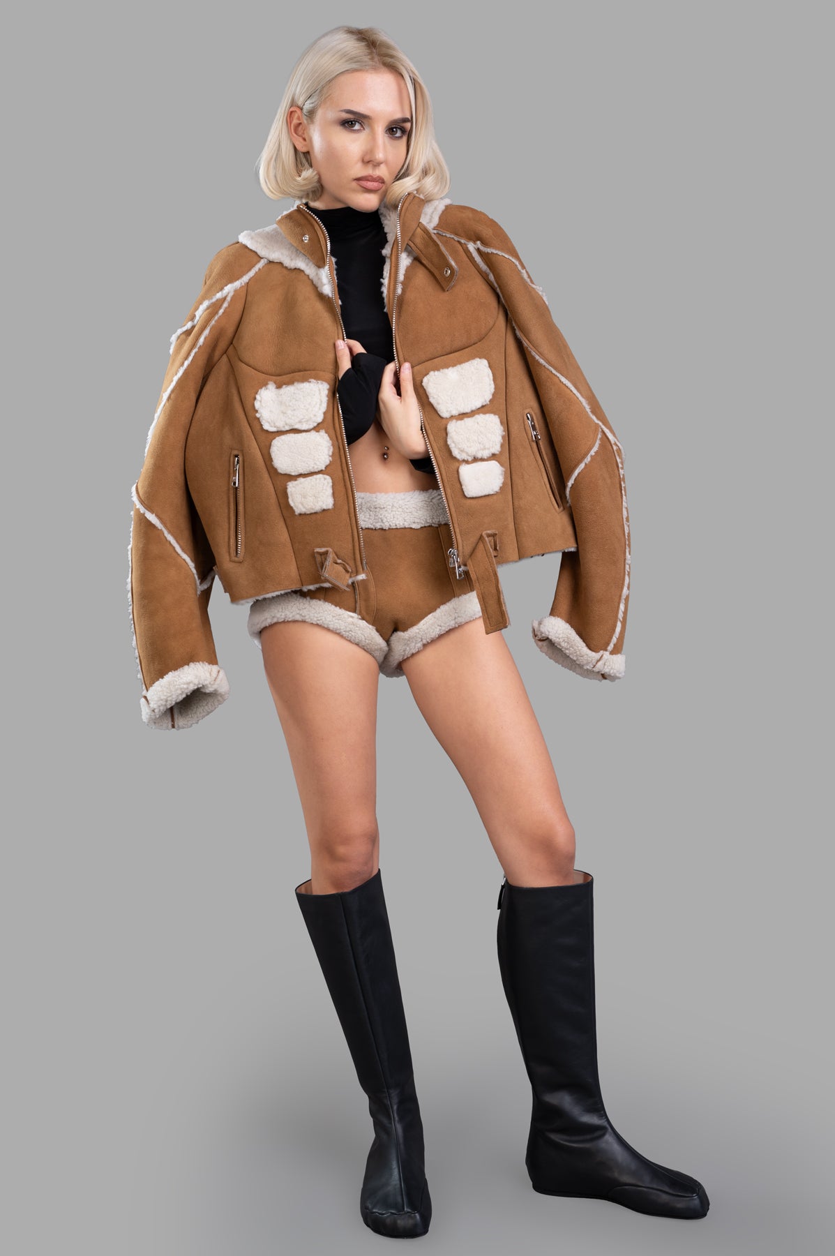 Natasha Zinko Sheepskin Mini Shorts in brown, front view on model, featuring faux shearling trim, paired with matching.