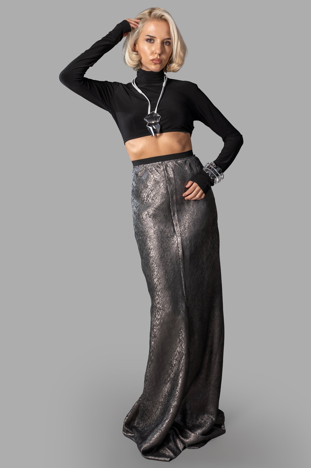 Avant Toi Shiny Maxi Skirt in grey, front view on model, showcasing high waist and elegant sheen, polyester fabric.
