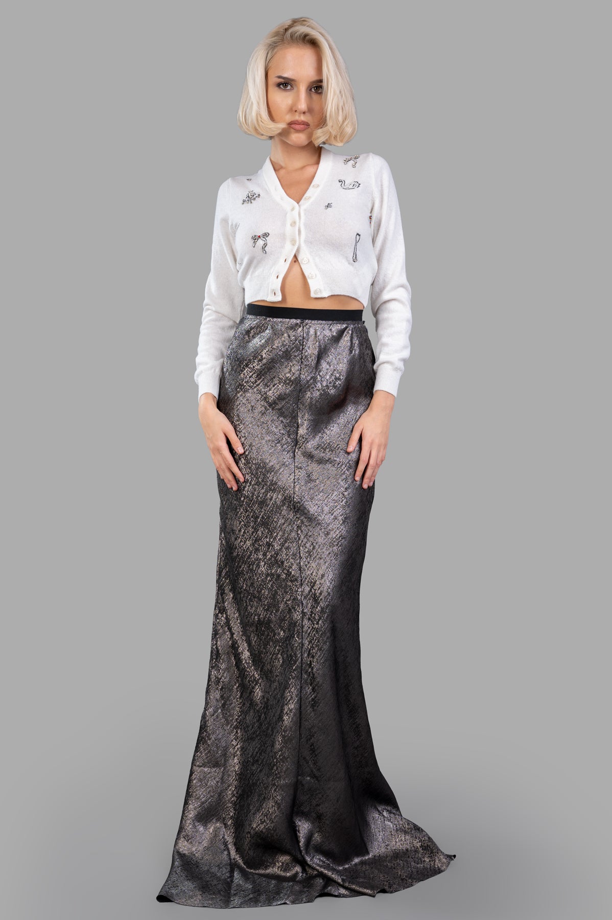 MSGM Embellished Cardigan on-model front view, white sequin detail, V-neck, button closure, paired with a long skirt.