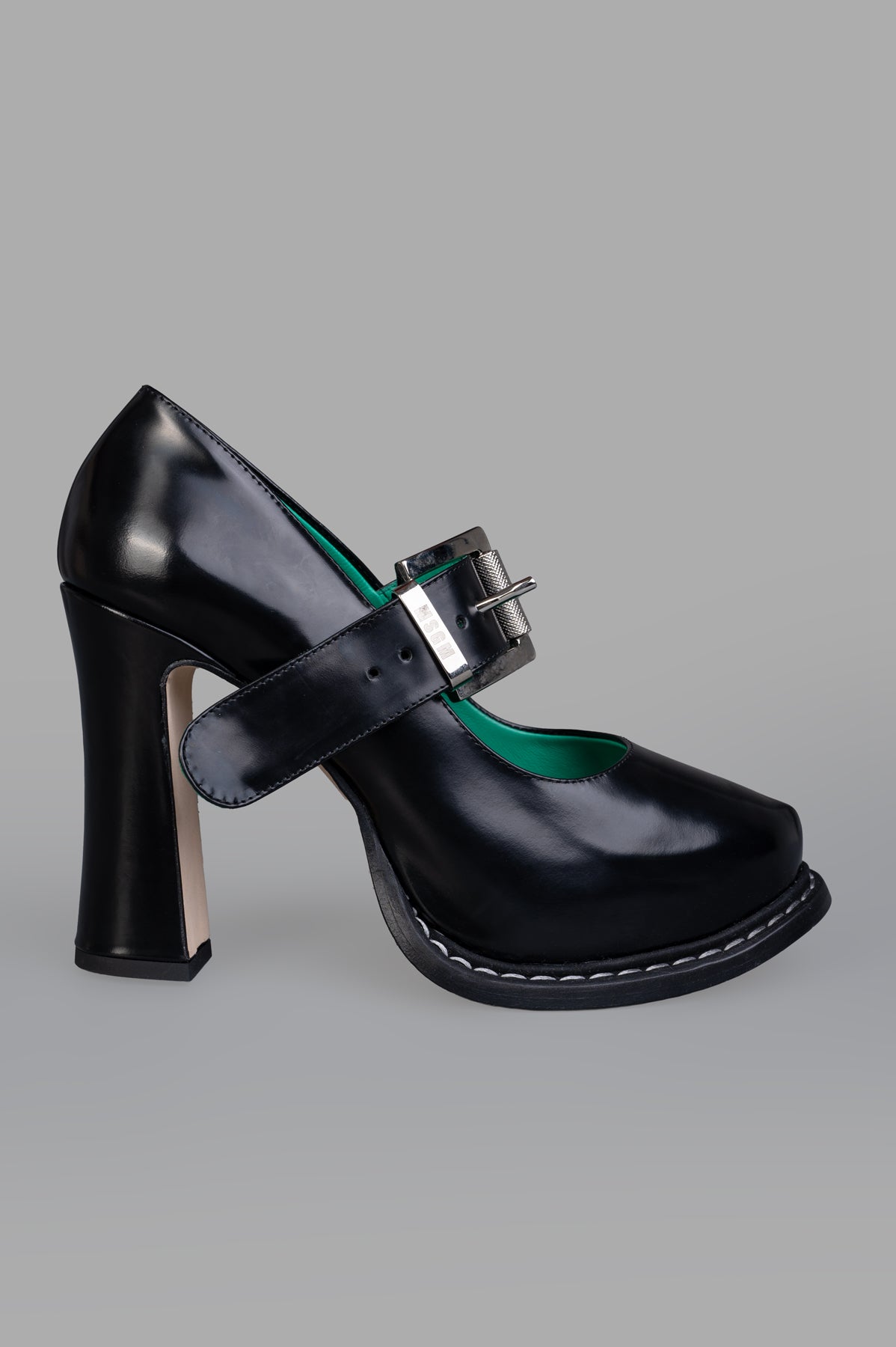 MSGM Patent Leather Mary Janes, side view; black with silver buckle, contrasting interior, visible stitching, 3-inch heel.