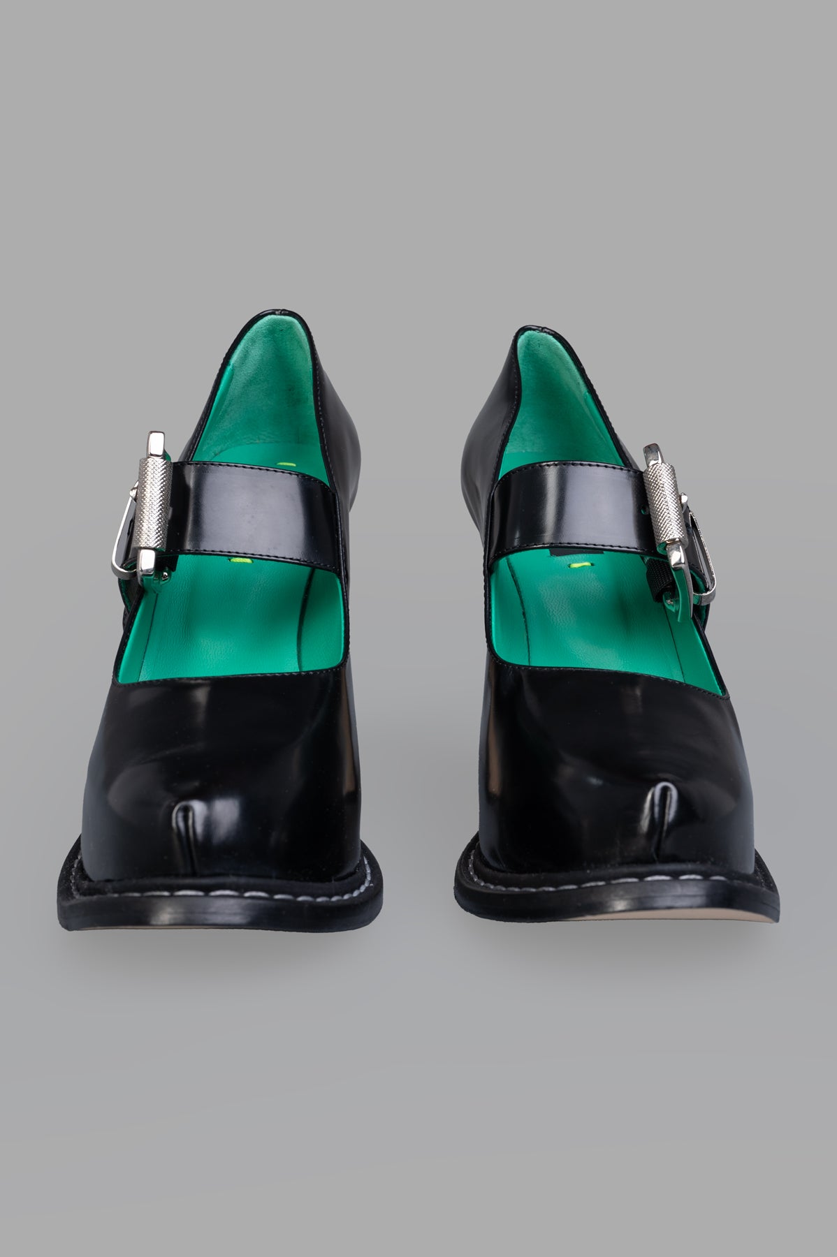 MSGM Patent Leather Mary Janes featuring a silver buckle and green polka dot interior, showcasing a front view and rounded.