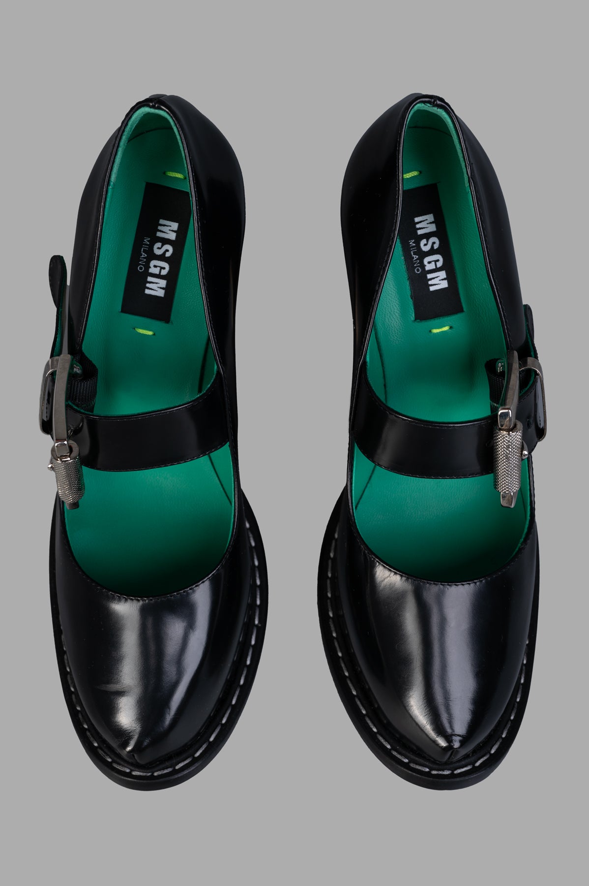 MSGM Patent Leather Mary Janes featuring a silver buckle and contrasting polka dot interior, viewed from above.