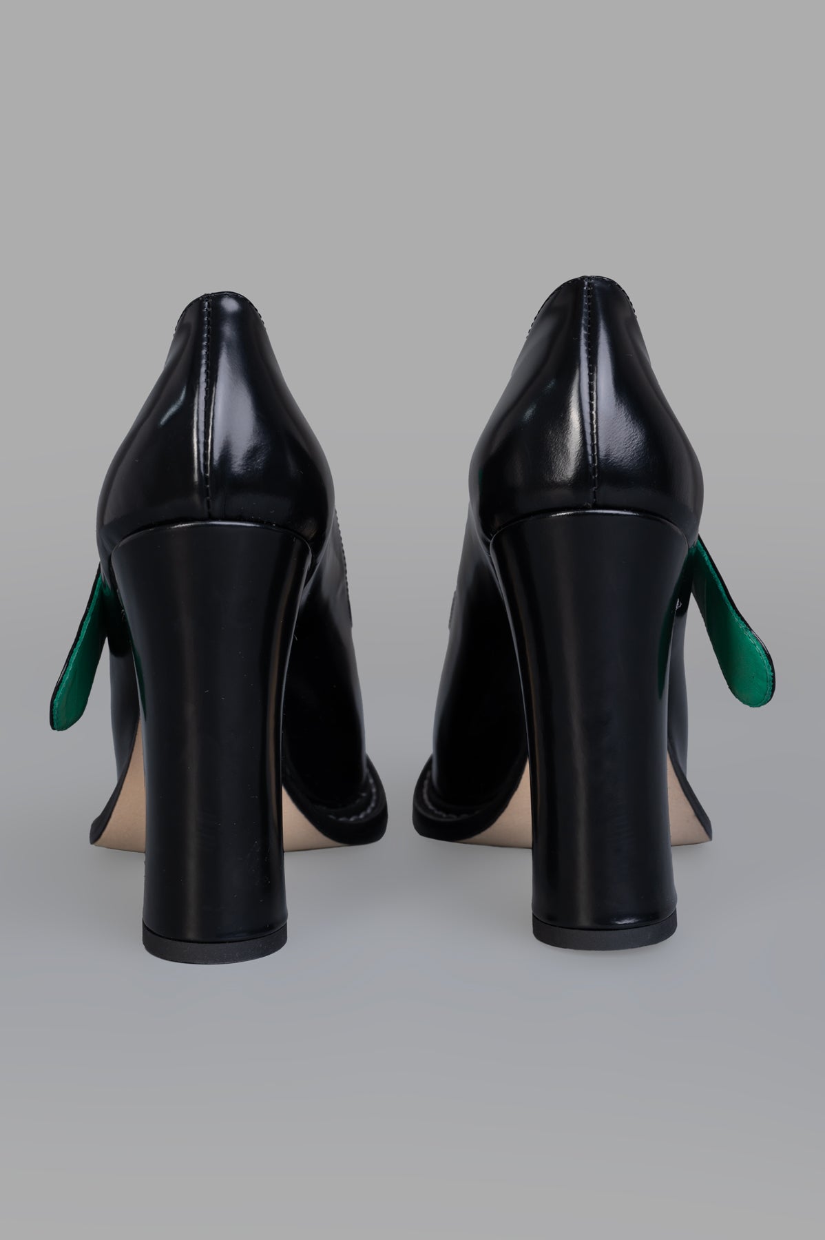 MSGM Patent Leather Mary Janes showcasing a black finish with a 3-inch platform heel and a contrasting interior polka dot.