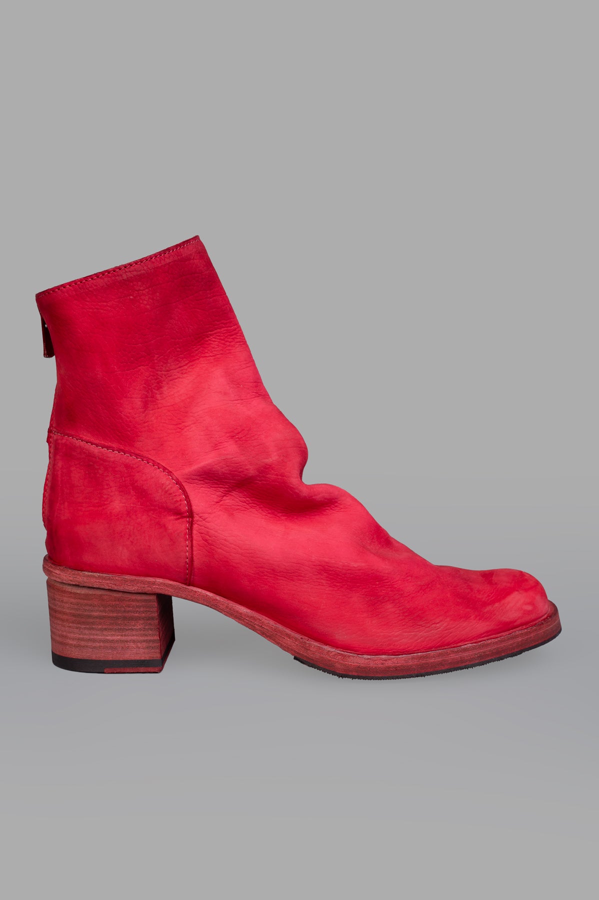 Shoto Back Zip Boots in vibrant red leather, side view showcasing sleek design and wooden heel.