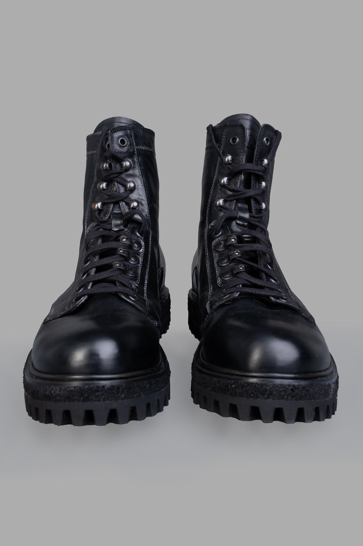 Shoto. Front view of black Lace-up Boots featuring a sturdy rubber sole and elegant laced design for winter style.