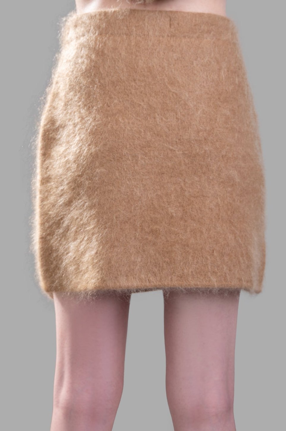 By Malene Birger Krissah Mini Skirt in brown, showcasing a fluffy mohair-blend texture and elastic waistband, front view.