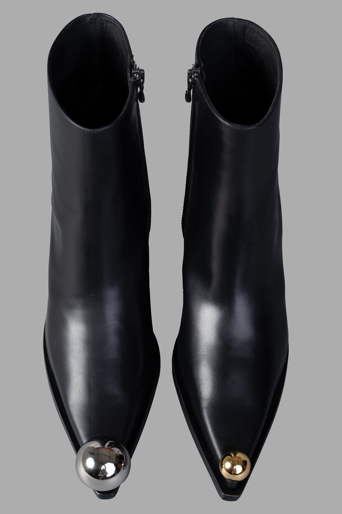 A.W.A.K.E. MODE Gabriel Cowboy Boots in black leather, featuring pointed toes and decorative metal accents on the front.
