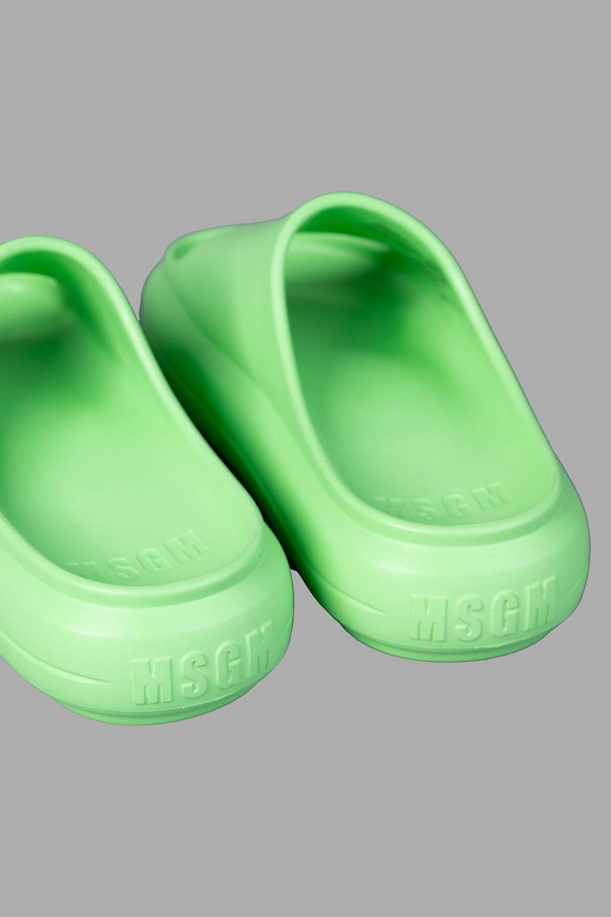 MSGM Ocean Club Sliders in bold green, showcasing soft rubber material and embossed logo detail for trendy summer comfort.