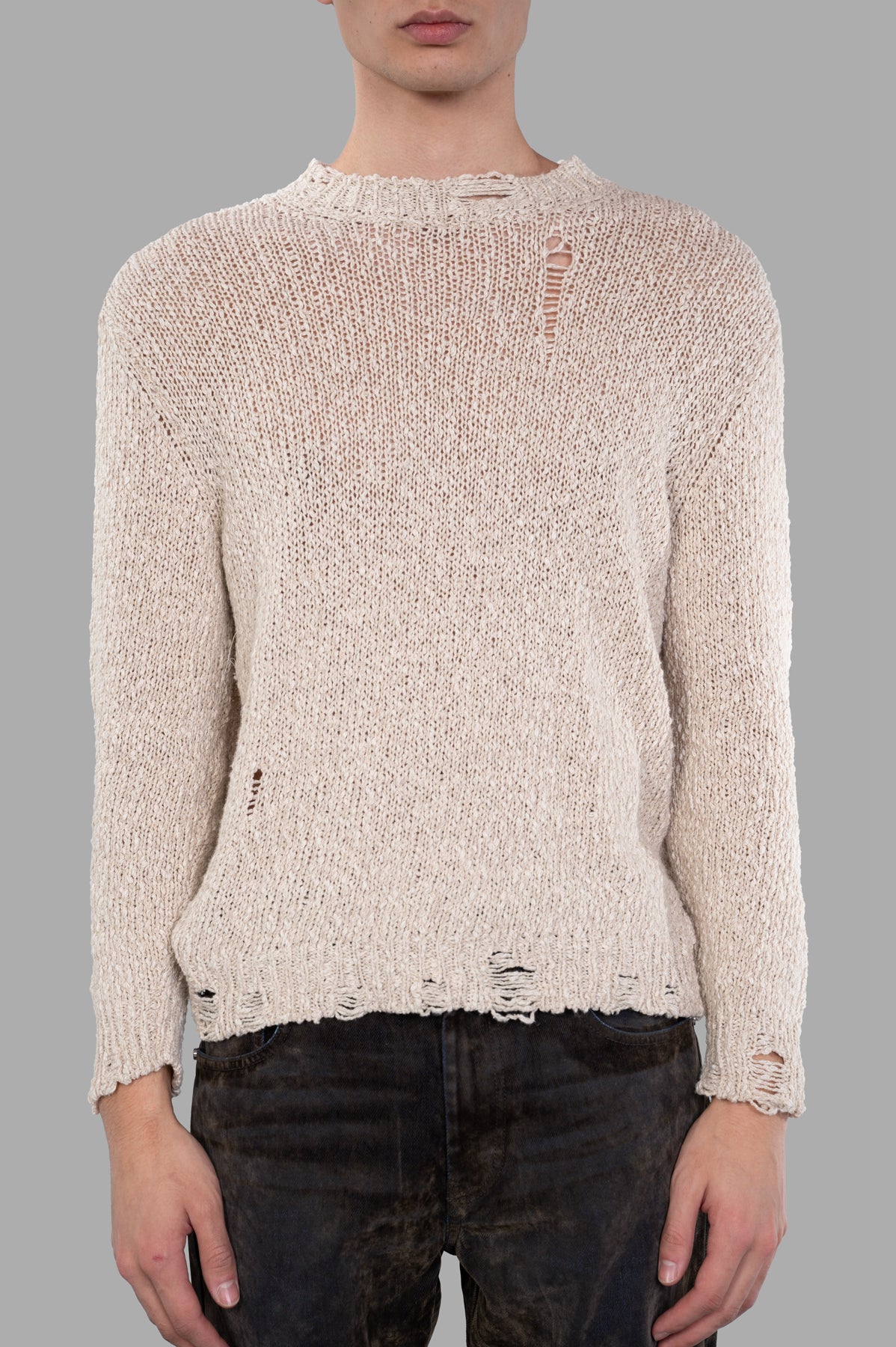Avant Toi Distressed Sweater in beige, featuring a crewneck design with vintage distressed details, worn on model.