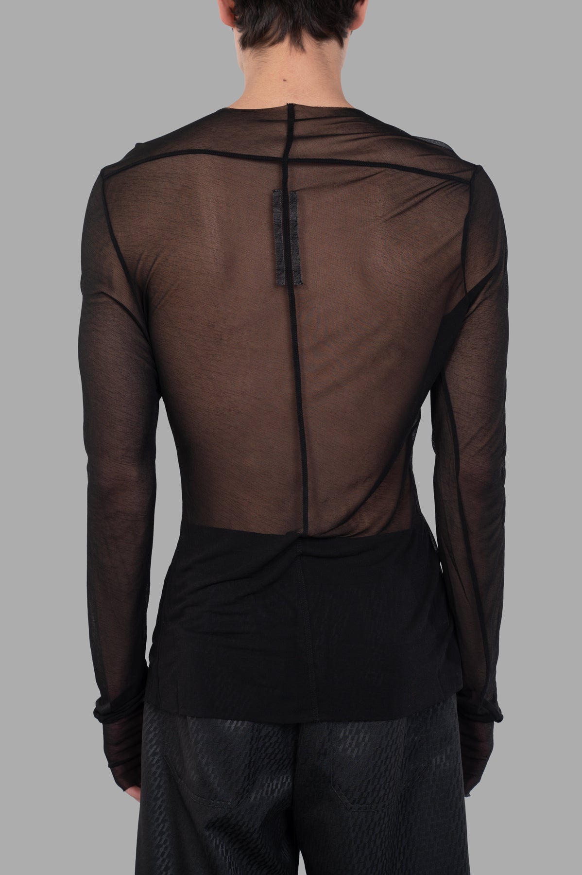 Rick Owens Edfu Sheer Top shown from the back, highlighting the skin-tight fit and signature seam details.