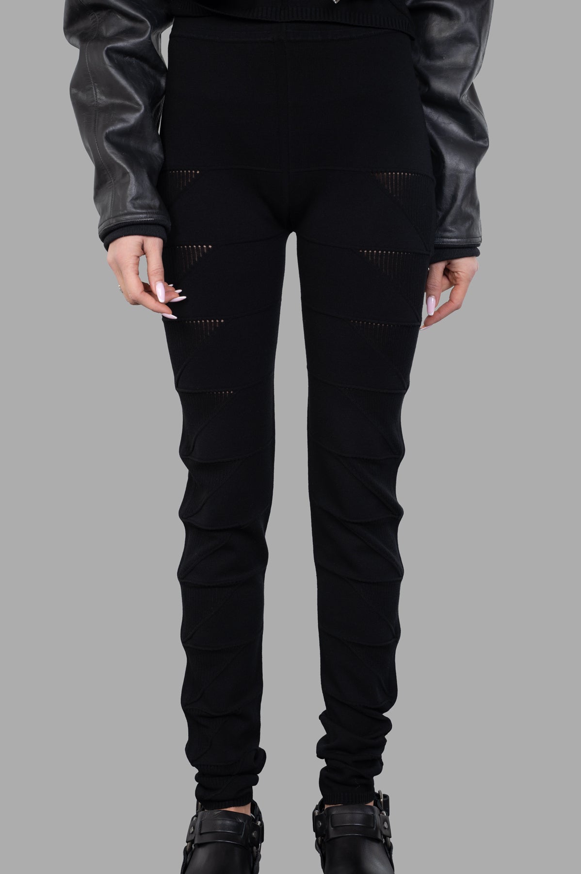 Rick Owens Knit Leggings feature a high waist and textured design, showcased here on model in black with stylish detailing.