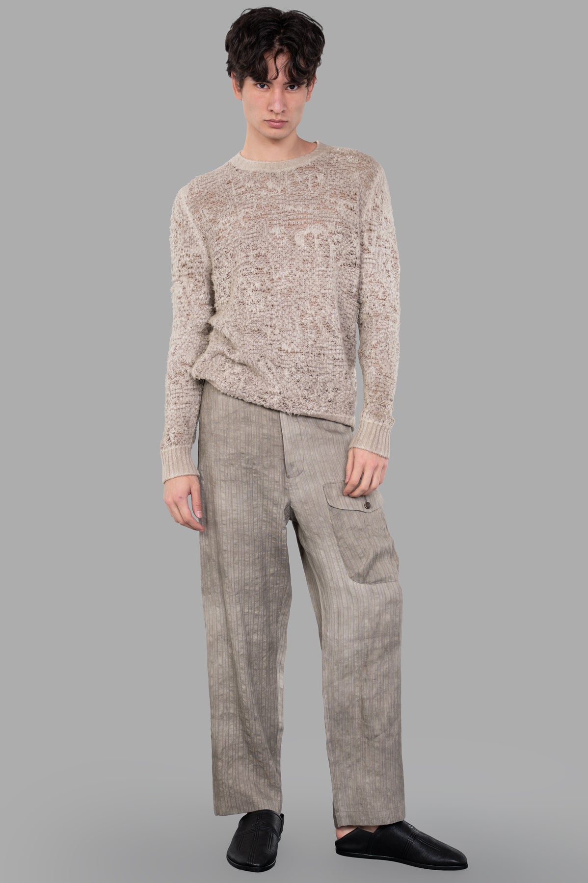 Avant Toi Crewneck Sweater, beige loose-fit with crocheted design, shown on model front view, ribbed neckline and cuffs.