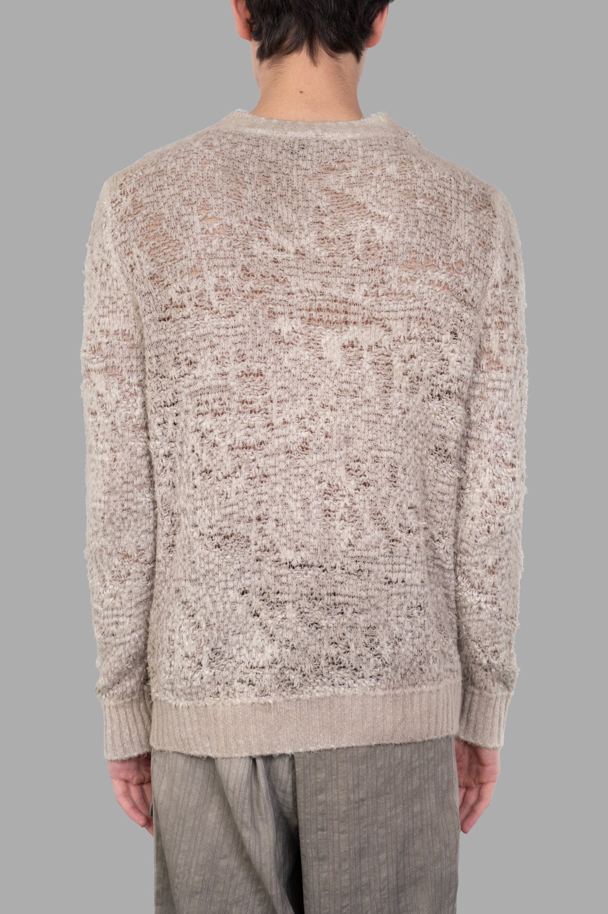 Avant Toi Crewneck Sweater in beige, featuring a cozy crocheted design and ribbed cuffs, showcased from the back.