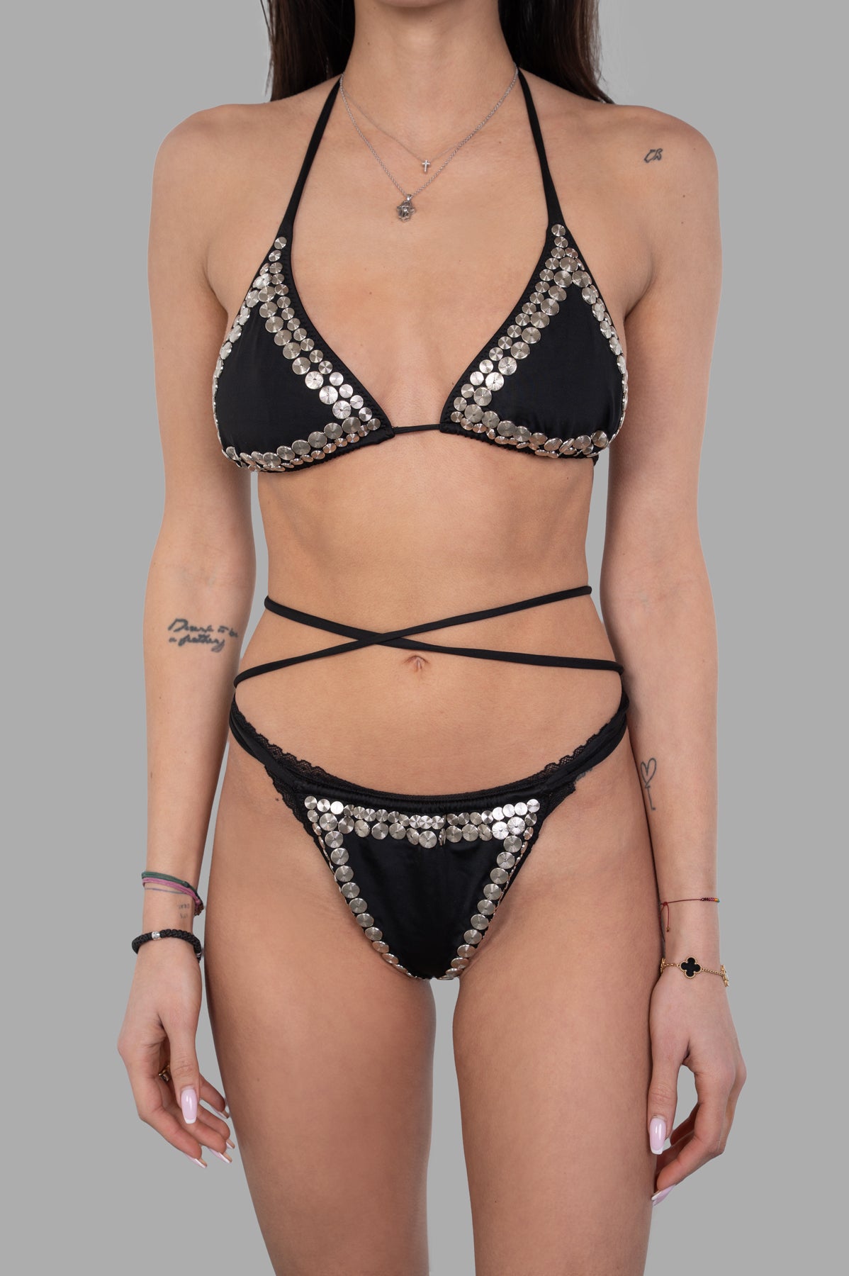 Norma Kamali Stud Criss-cross Bikini, featuring a stunning triangle top with silver studs and criss-cross strap design.