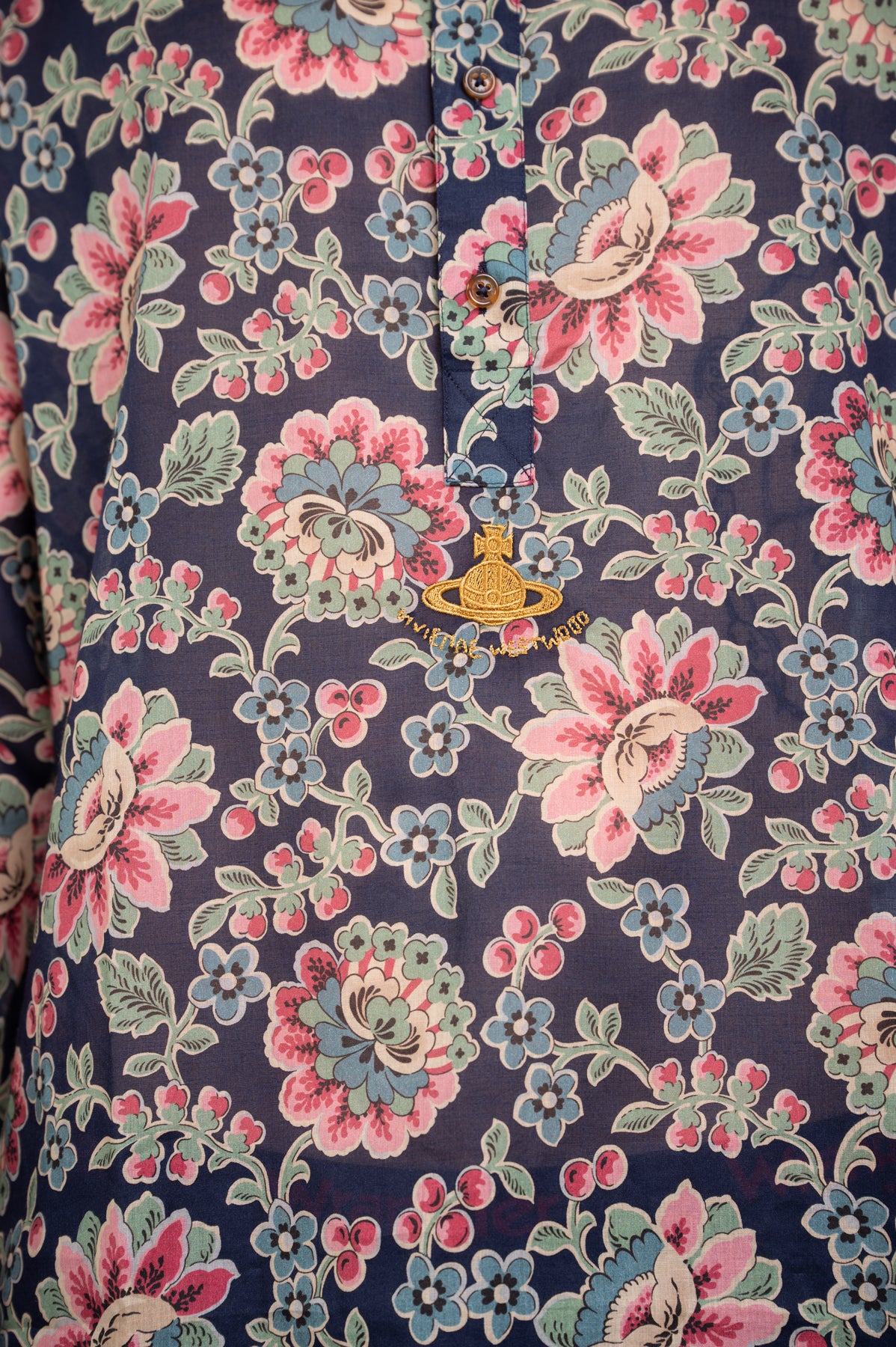 Vivienne Westwood Floral Mandarin Shirt featuring vibrant floral print and detailed orb embroidery on a navy background.