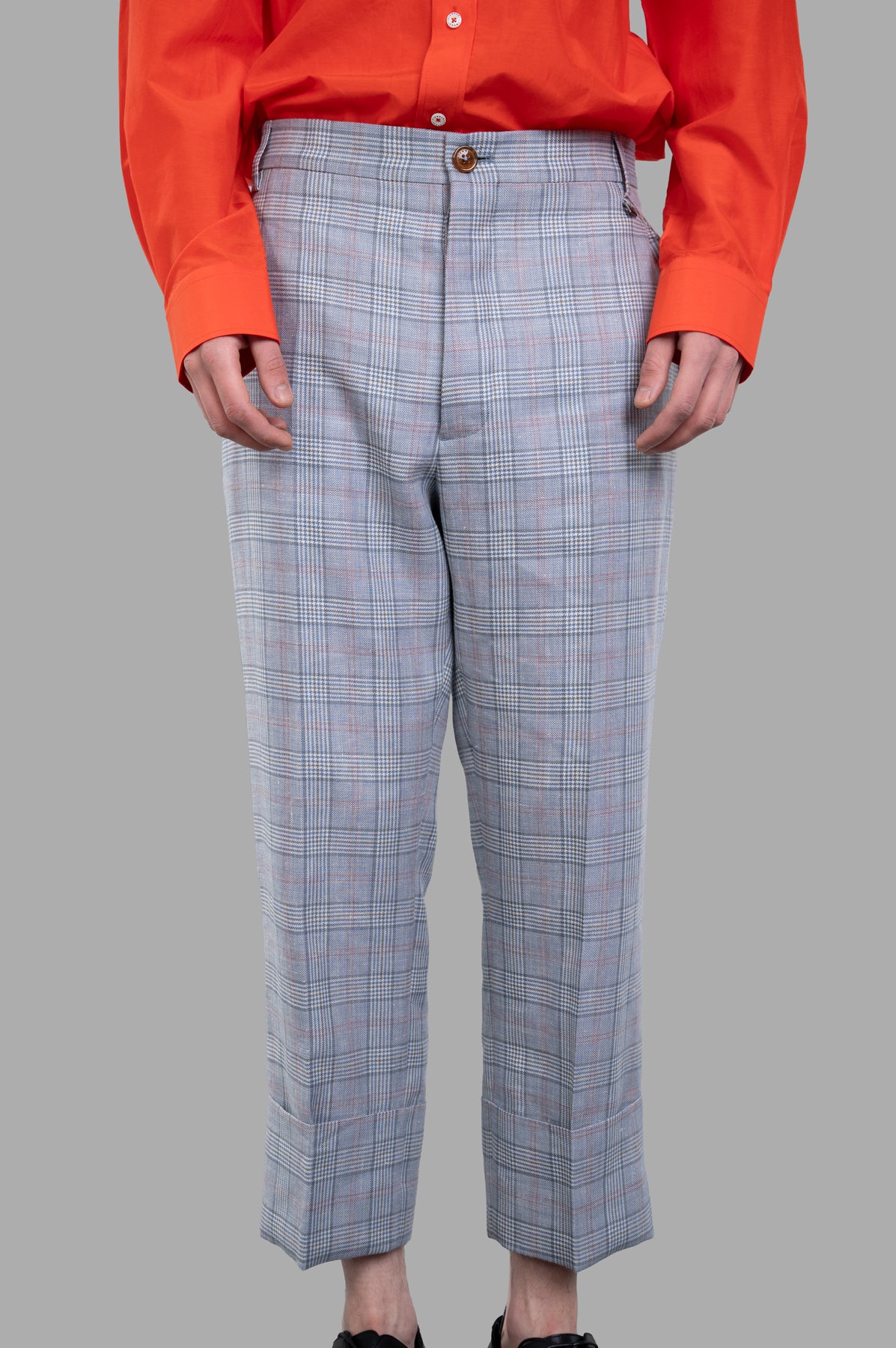 Vivienne Westwood Cropped George Trousers with Prince of Wales check, showcasing front and exaggerated cuff details.