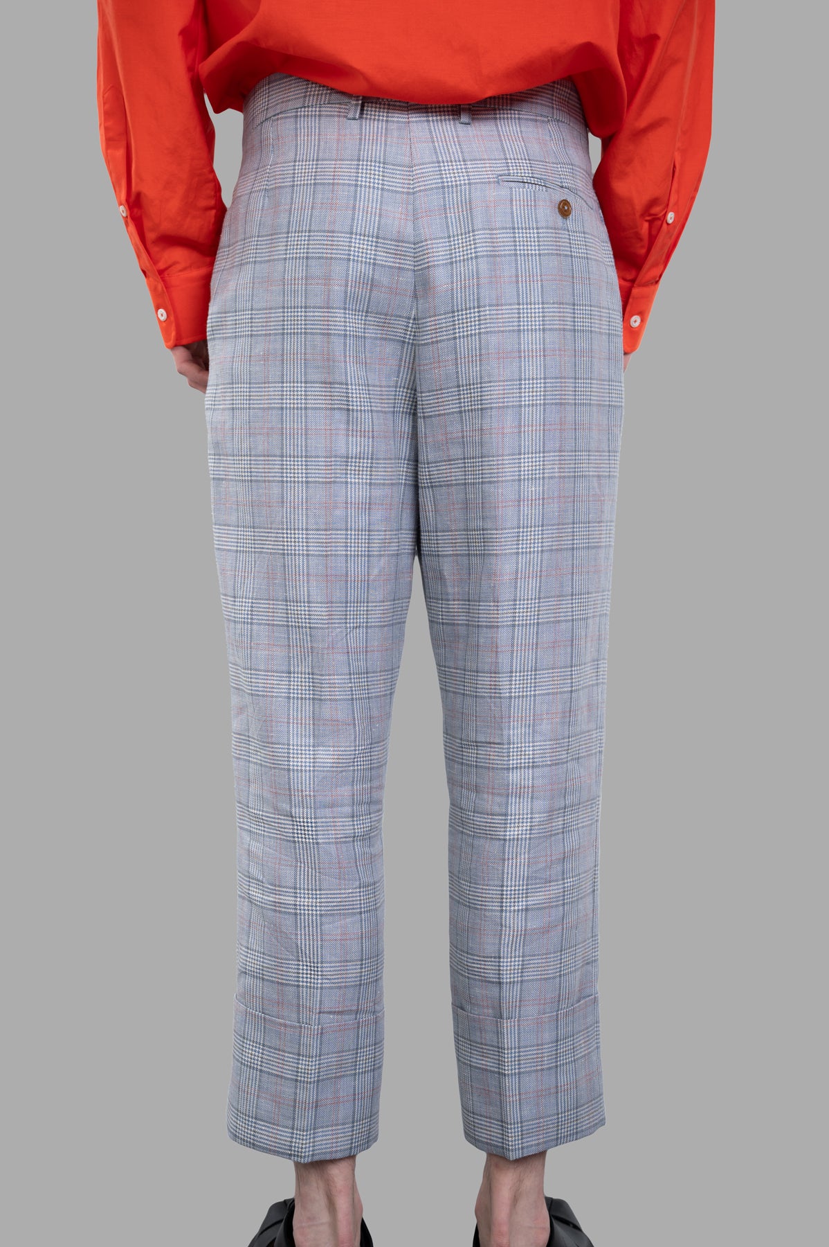 Vivienne Westwood Cropped George Trousers featuring Prince of Wales check, back view with exaggerated turn-up cuffs.