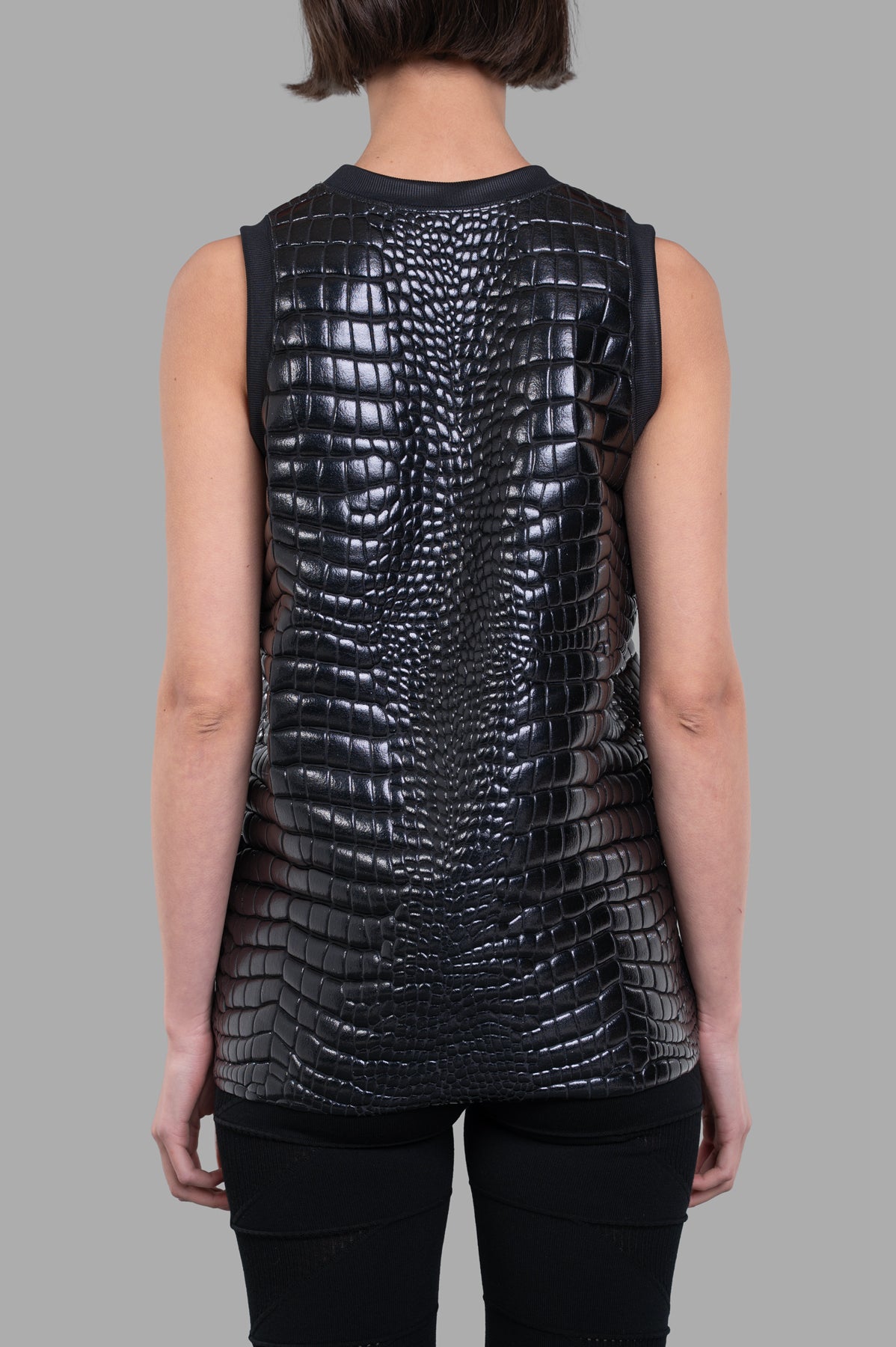 **Alt text:** Junya Watanabe Crocodile-embossed Top, black, sleeveless, showing textured back detail on model.