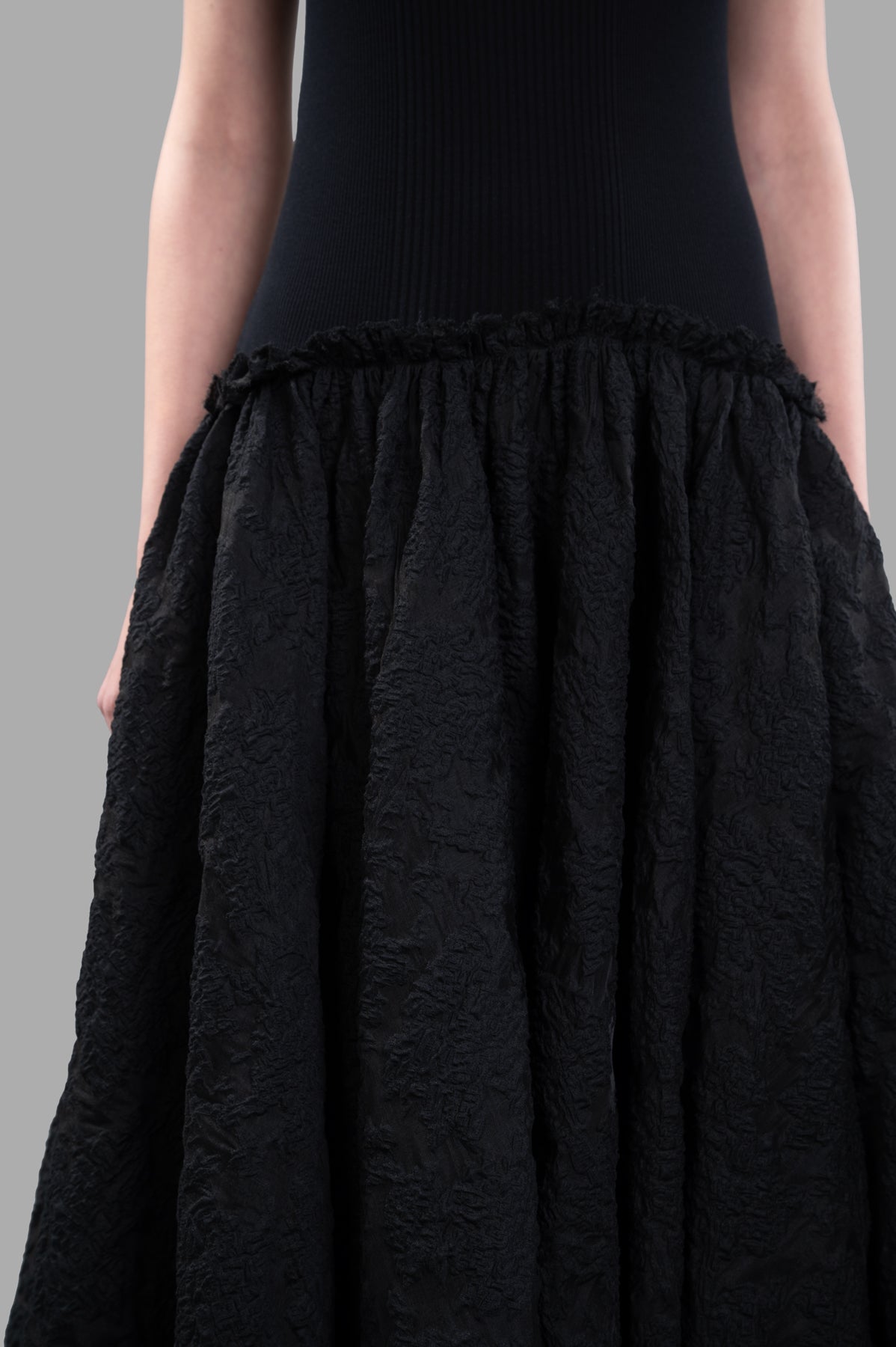 Marc Point Long Bustier Dress showcasing a textured black maxi skirt with a voluminous silhouette and close-up of the bodice.