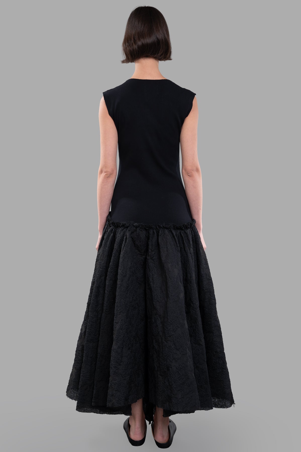 Marc Point Long Bustier Dress, back view showcasing maxi sleeveless design and full skirt in elegant black texture.