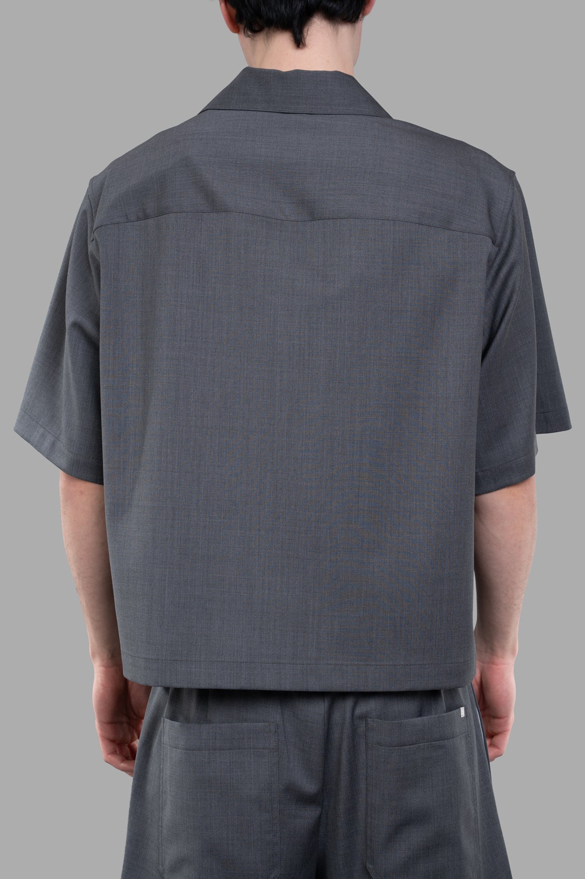 Helmut Lang Boxy Shirt shown from the back, highlighting the sleek cut and fabric texture on-model.