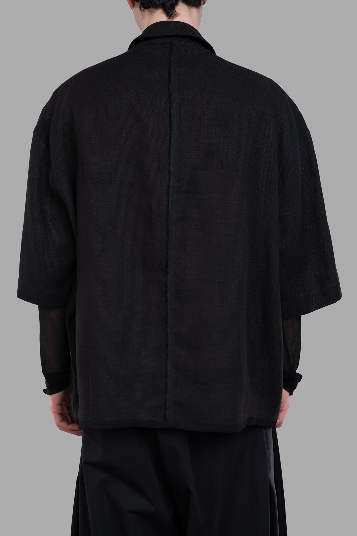 Giovanni Cavagna Cropped-sleeve Blazer, back view showcasing sleek design and texture, ideal for Peaky Blinders-inspired style.
