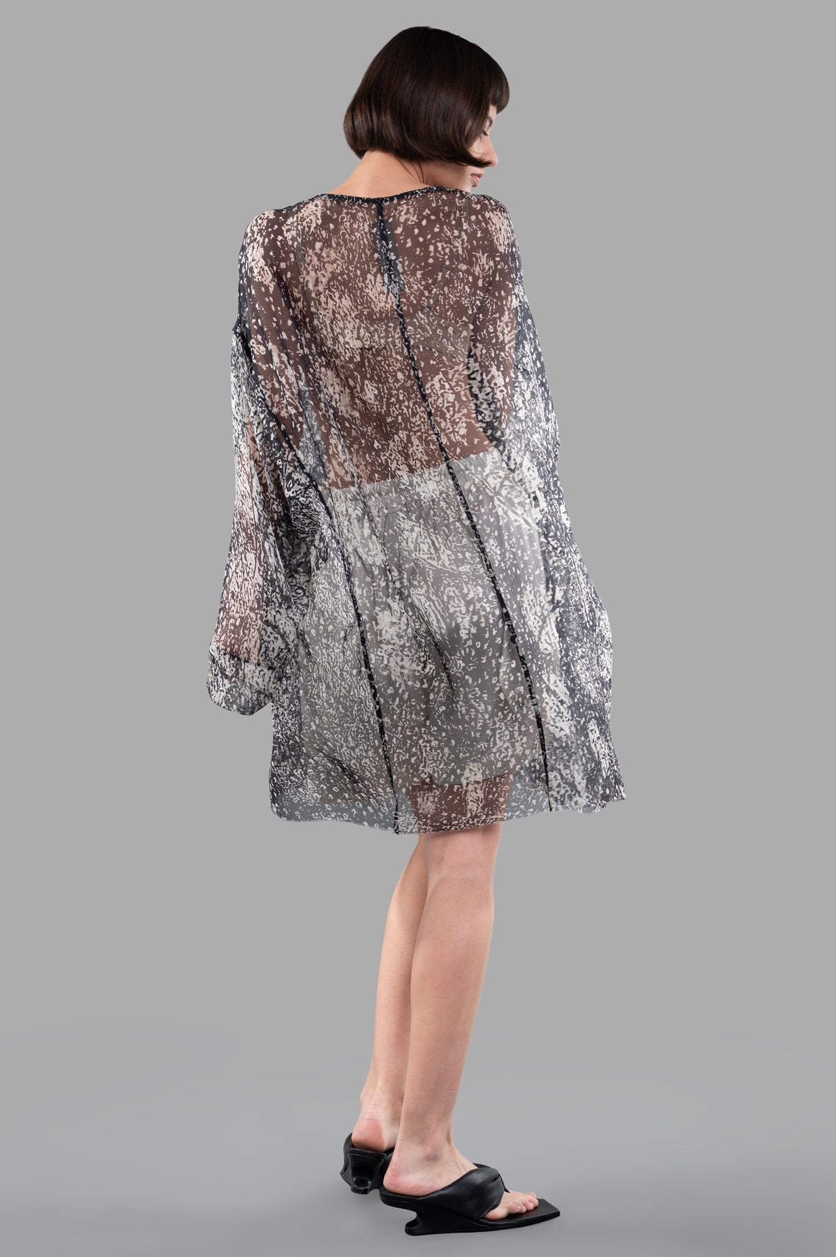 Rick Owens Transparent Tunic in black/white silk, back view, featuring central seam and boat neckline, worn by model.