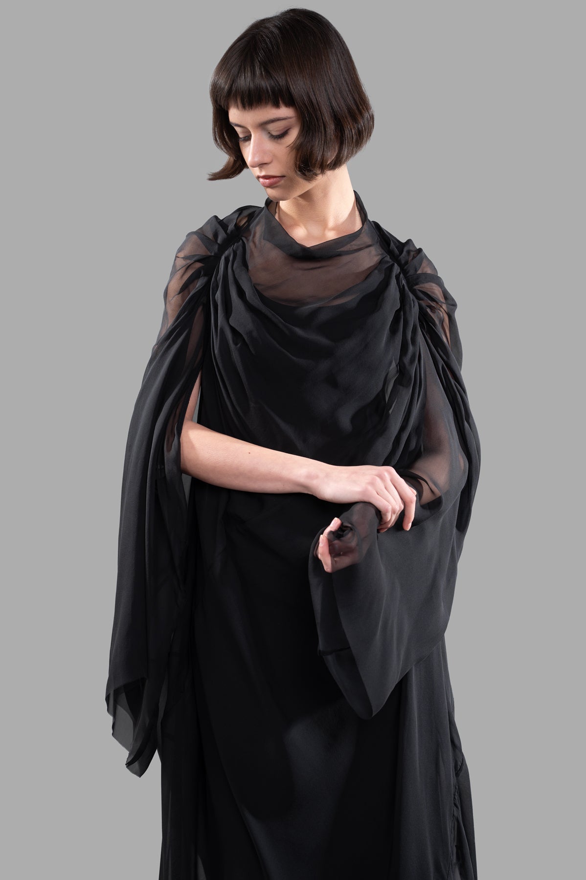 Rick Owens Draped Semi-Sheer Maxi Dress with delicate ruching and wide sleeves, showcasing a unique volume in black silk.