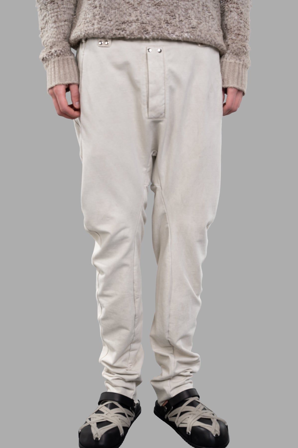 Masnada Drop-crotch Pants in ecru feature an elasticized waist and drawstring, displayed on-model for a stylish look.