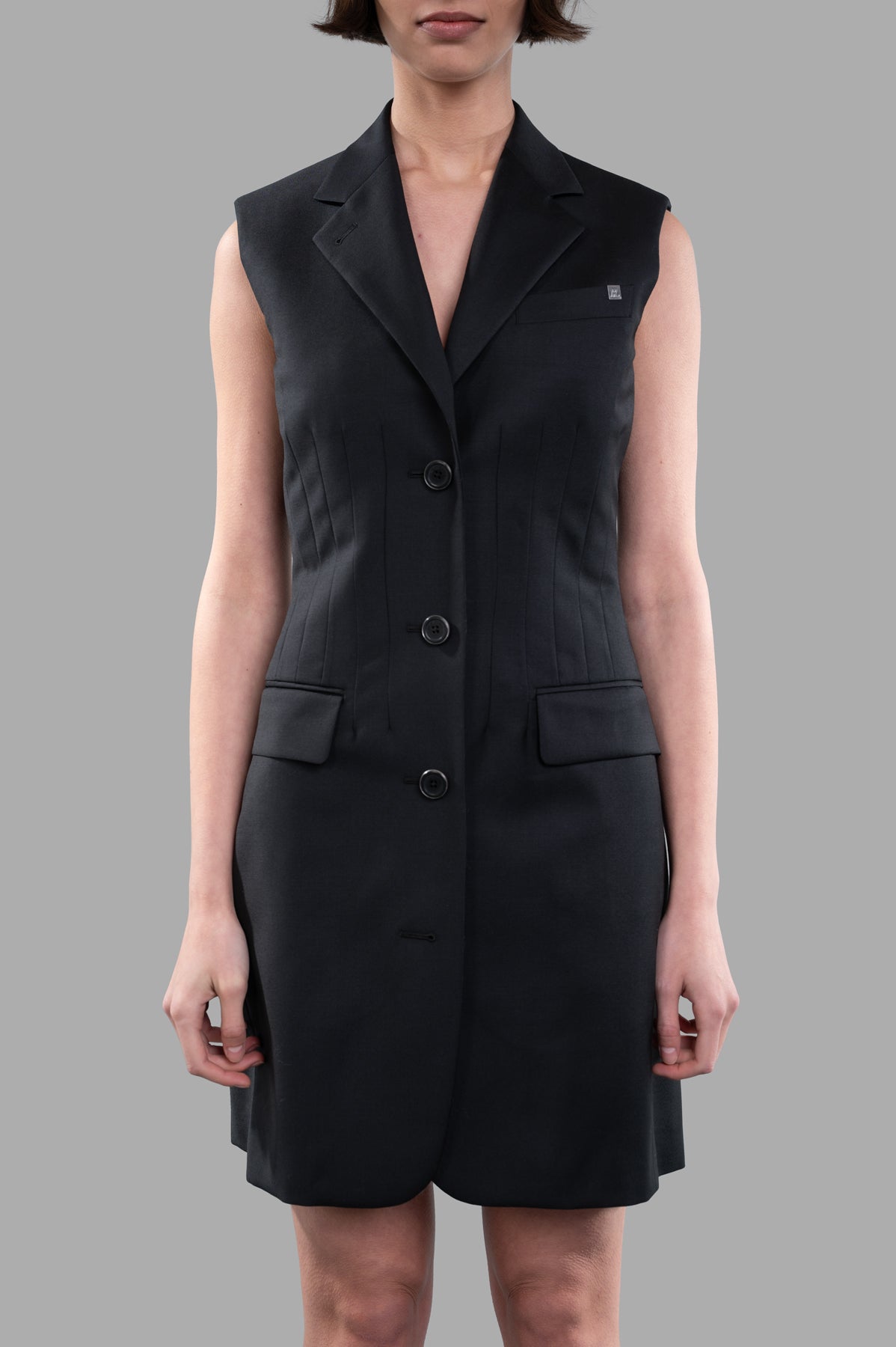Helmut Lang Waisted Blazer Dress displayed front view, featuring tailored fit, notched lapels, and functional waist flap.