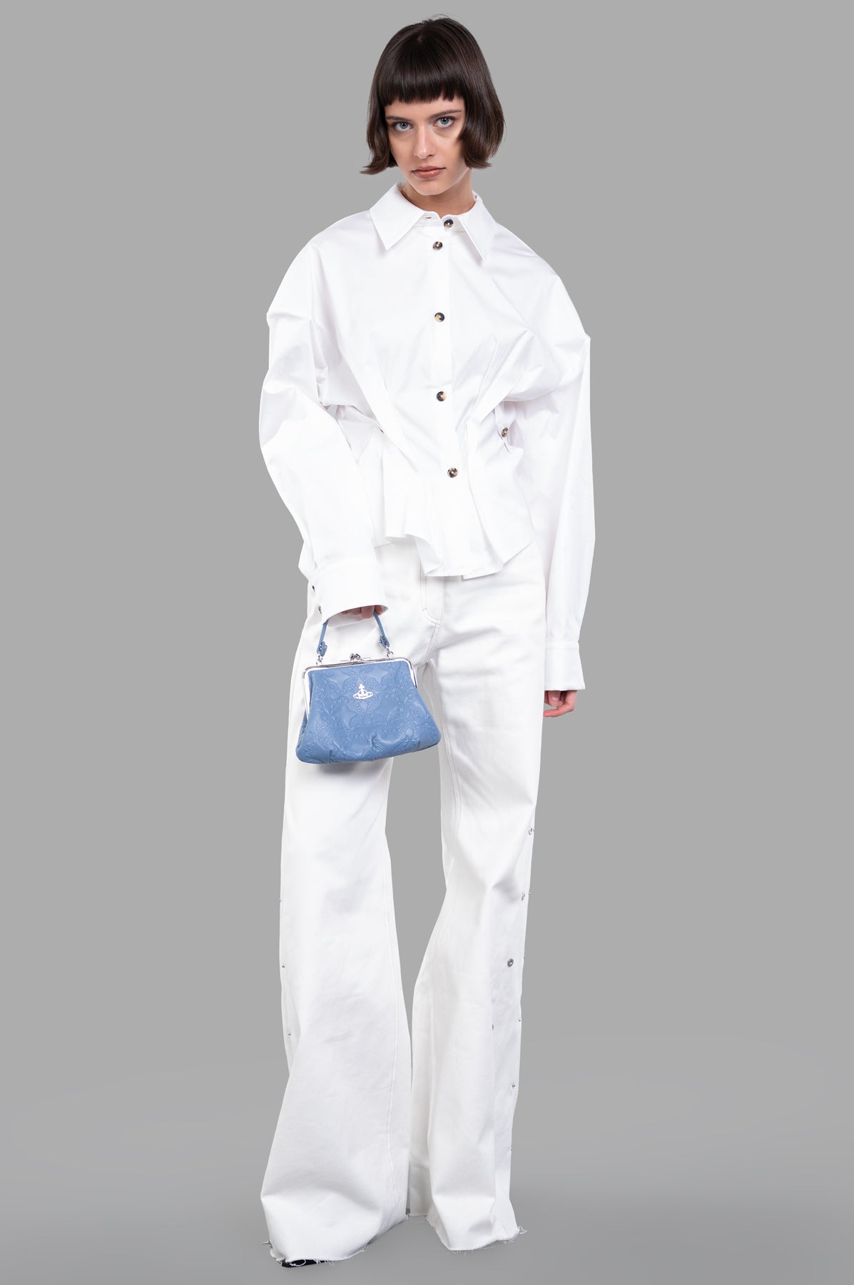 Sehnsucht Atelier wide-leg jeans in white, front view on model, high-waisted with metal-button accents, 100% cotton.