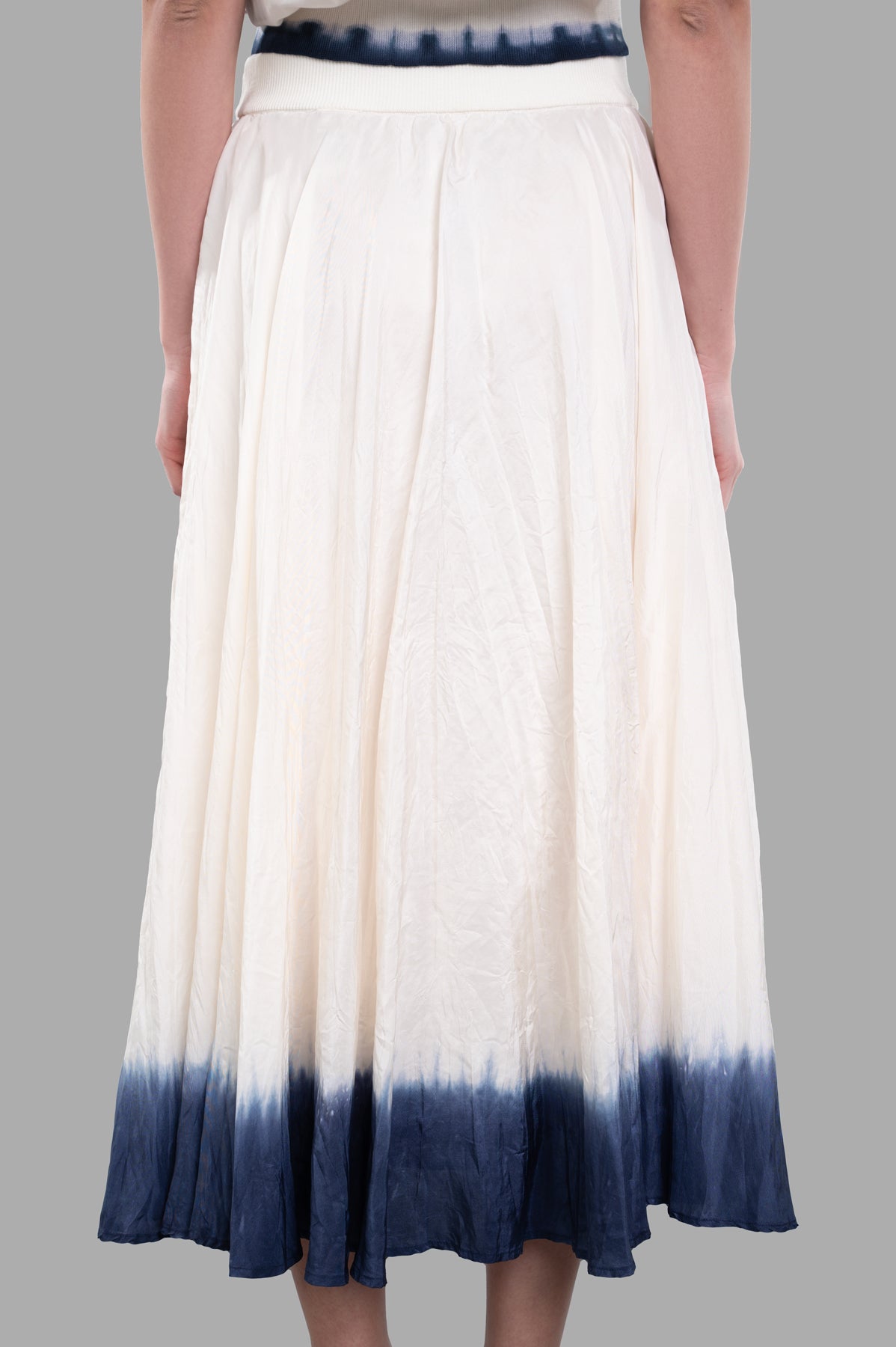 Joseph Gradient Skirt featuring a tie-dye hemline, elasticated waistband, shown from the back in habotai silk.