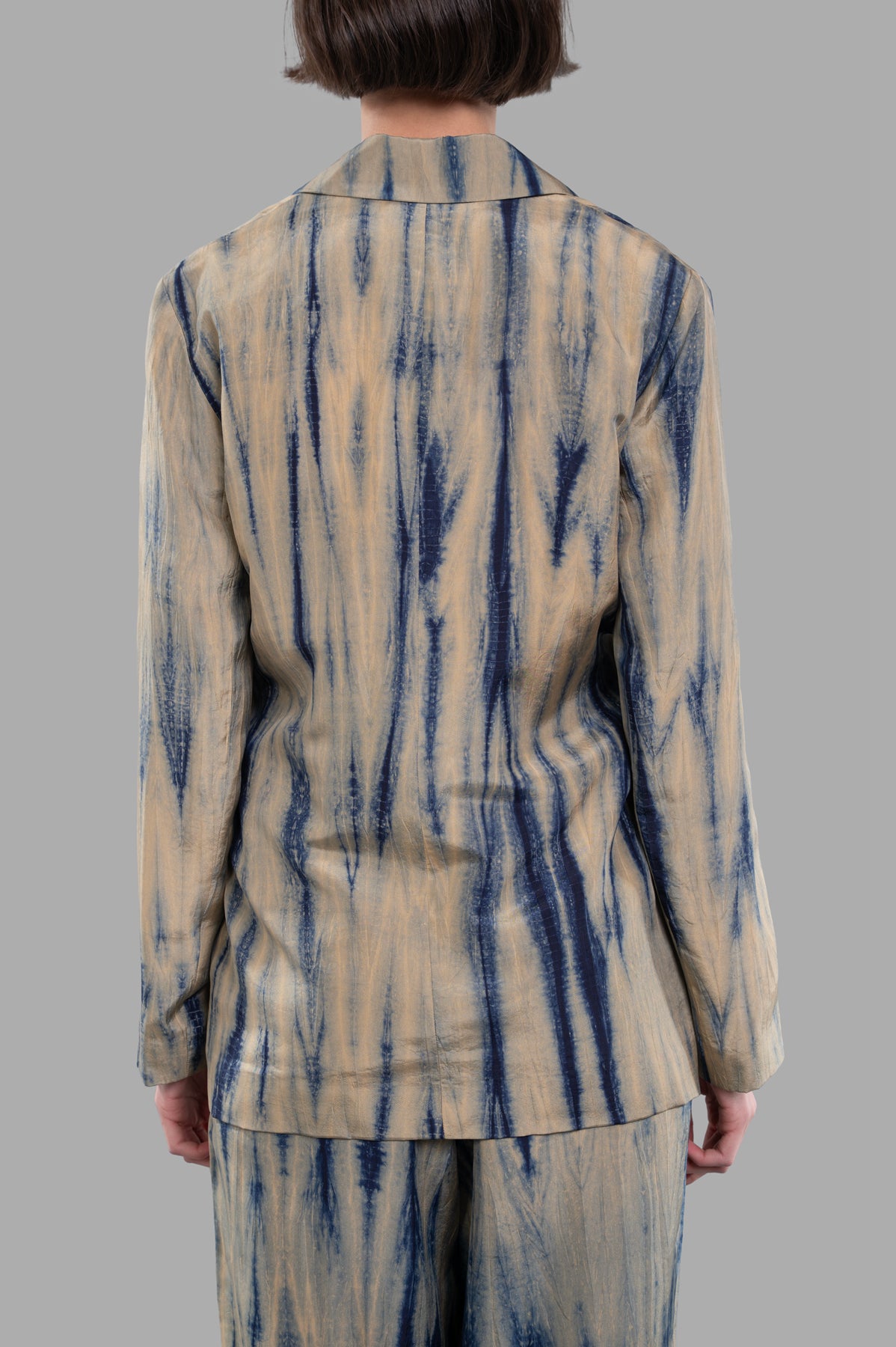 Joseph. Tie-dye Silk Jacket seen from the back, showcasing the sand and navy pattern in luxurious habotai silk.