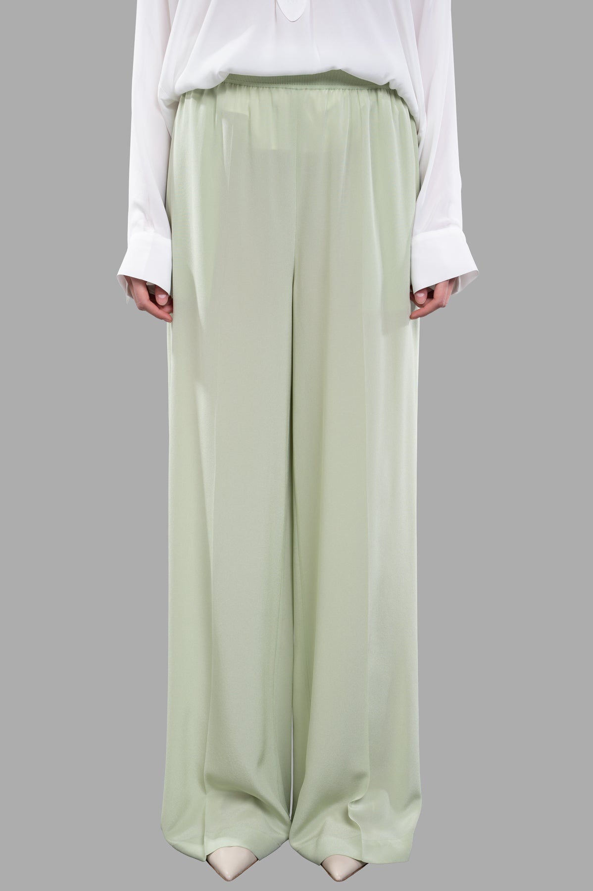 Joseph Crepe de Soie Silk Trousers in Matcha, lightweight wide-leg design on model, showcasing subtle pleats and fluidity.
