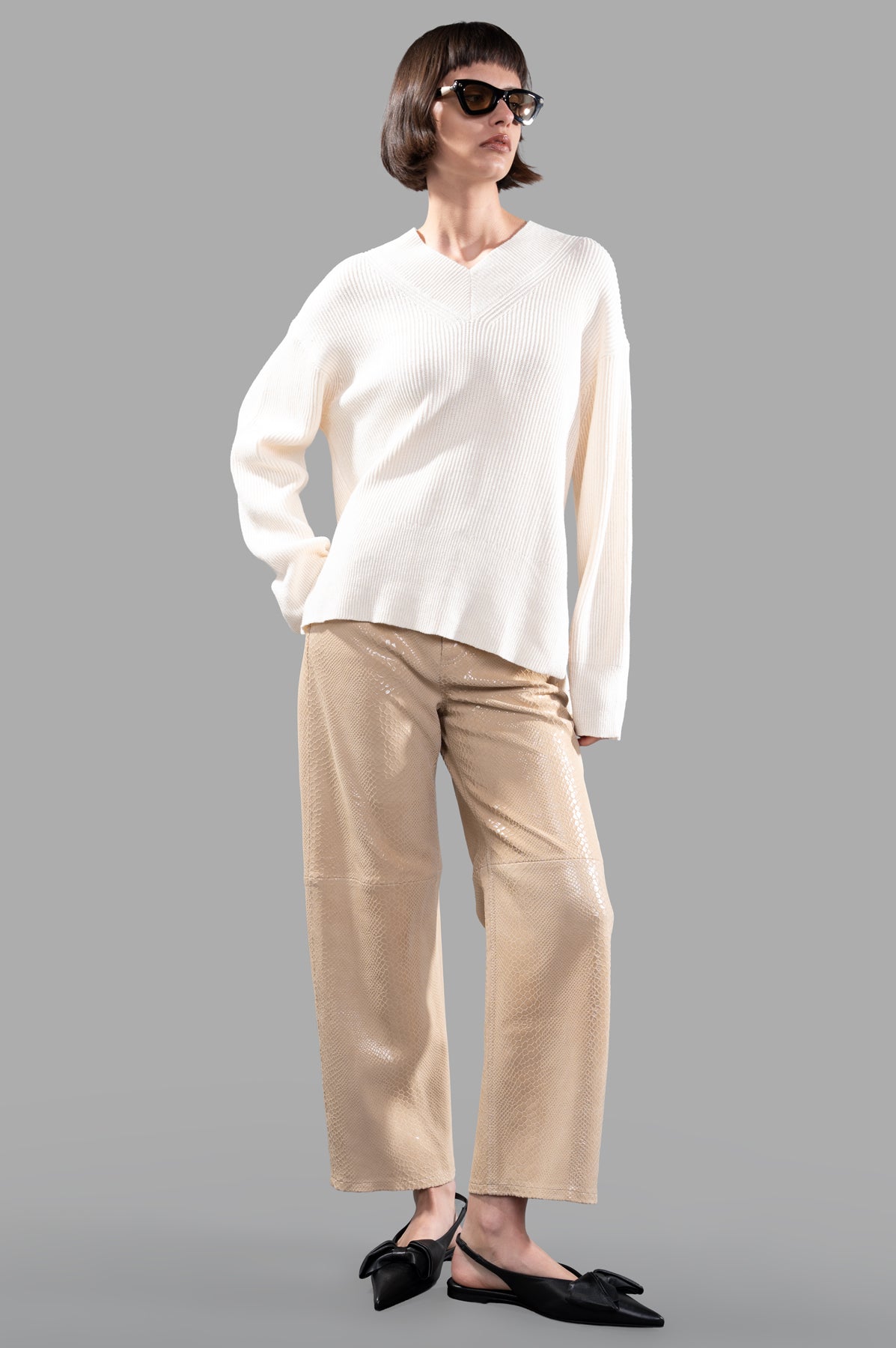 Joseph Linen Blend Jumper in ecru, worn by model, showcasing V-neck and relaxed fit, perfect for warm days.