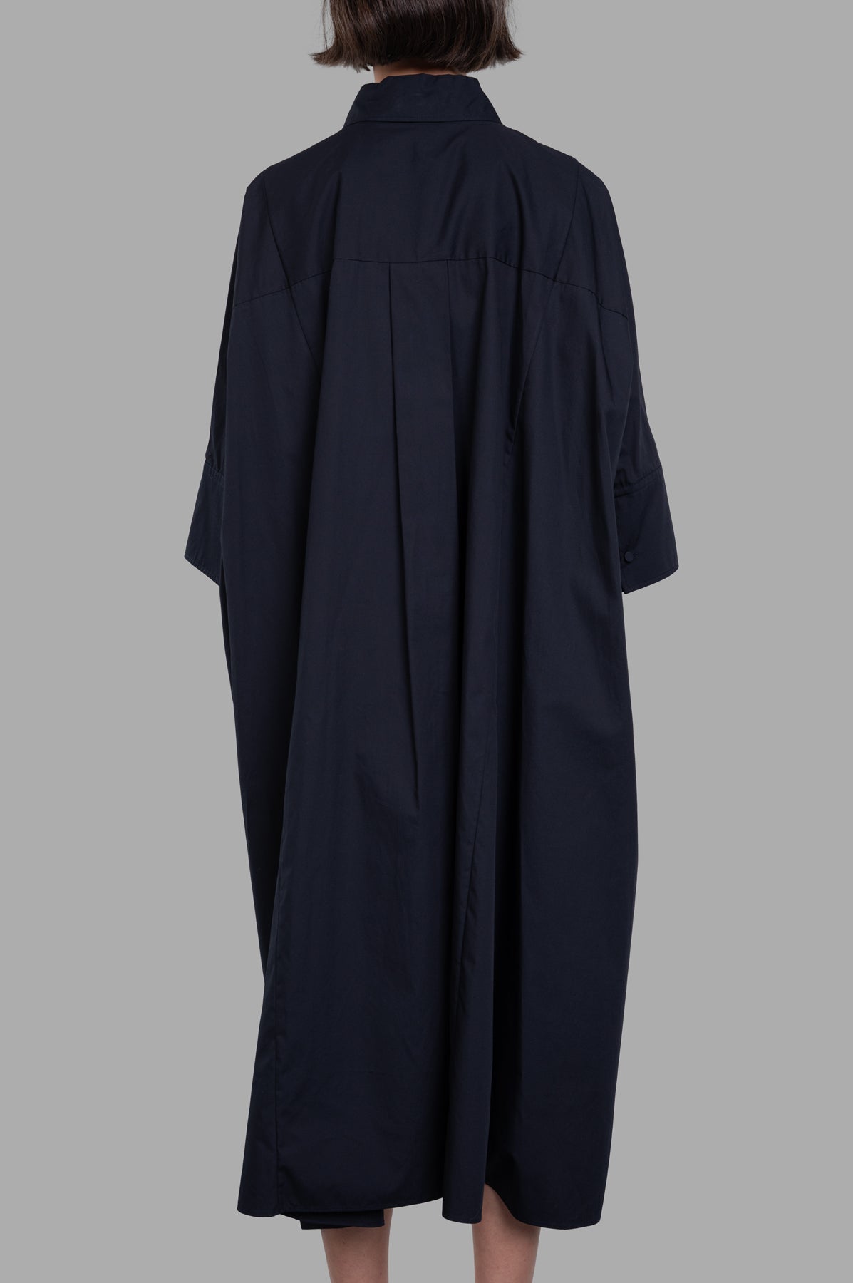 Joseph. Oversized Dania Poplin Cotton Dress in black, showcasing a relaxed fit with dropped shoulders and step hemline.