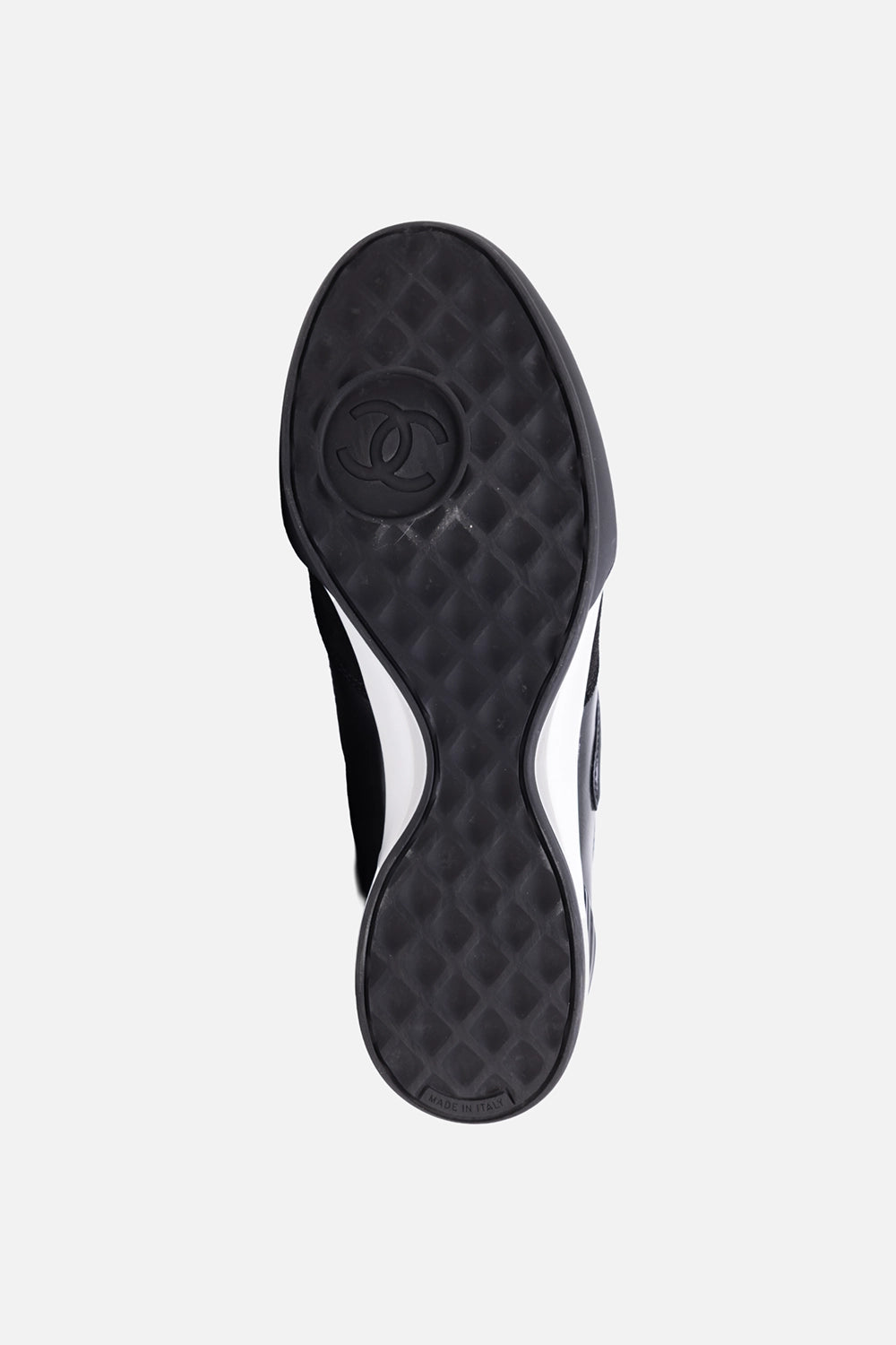 Pre-owned Chanel women’s low-top sneakers in black and white, outsole view, textured tread with CC motif