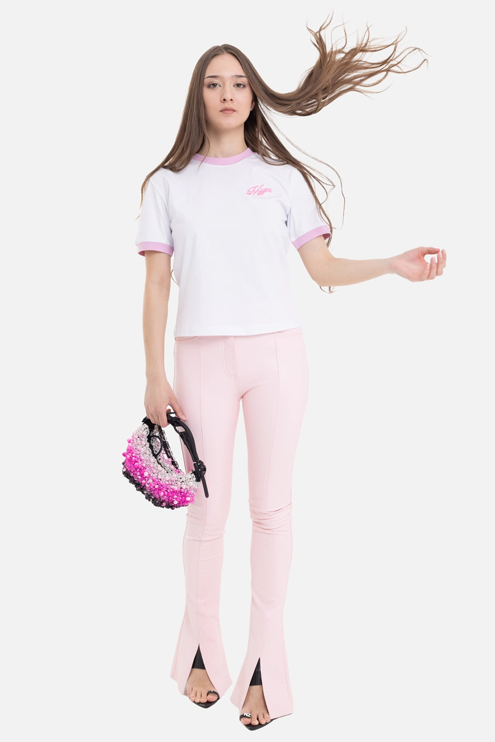 Norma Kamali women's Spat Jeans in ballet pink, on-model full length with high waist and front slits