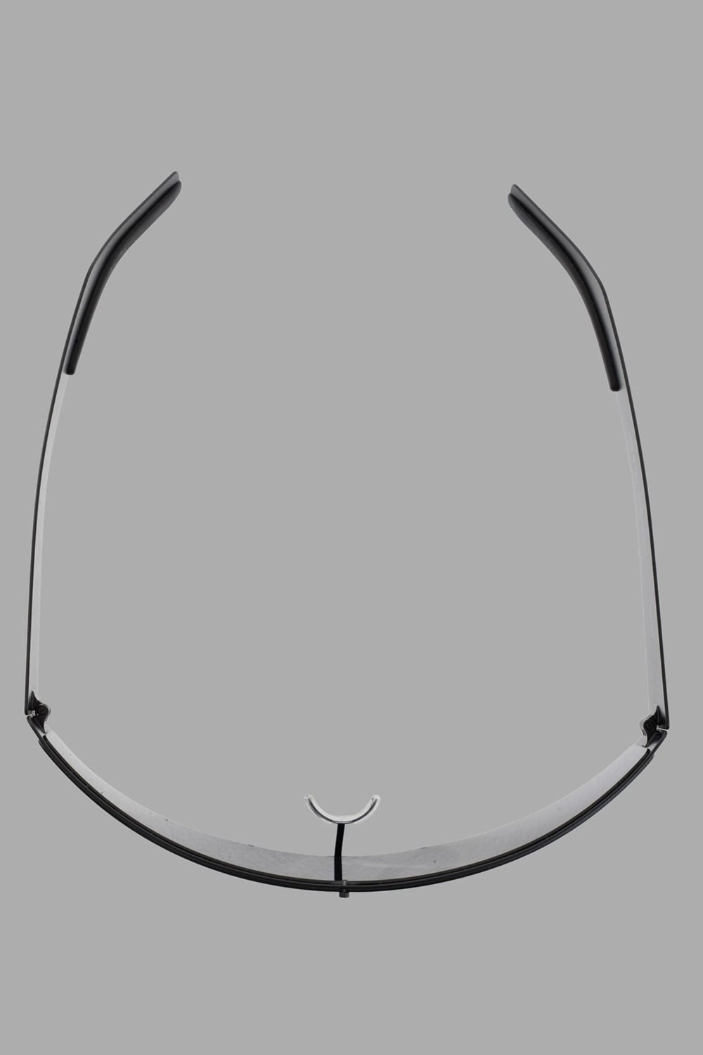 Rick Owens sunglasses in black, hardware close-up, rubber nose saddle and wraparound lens