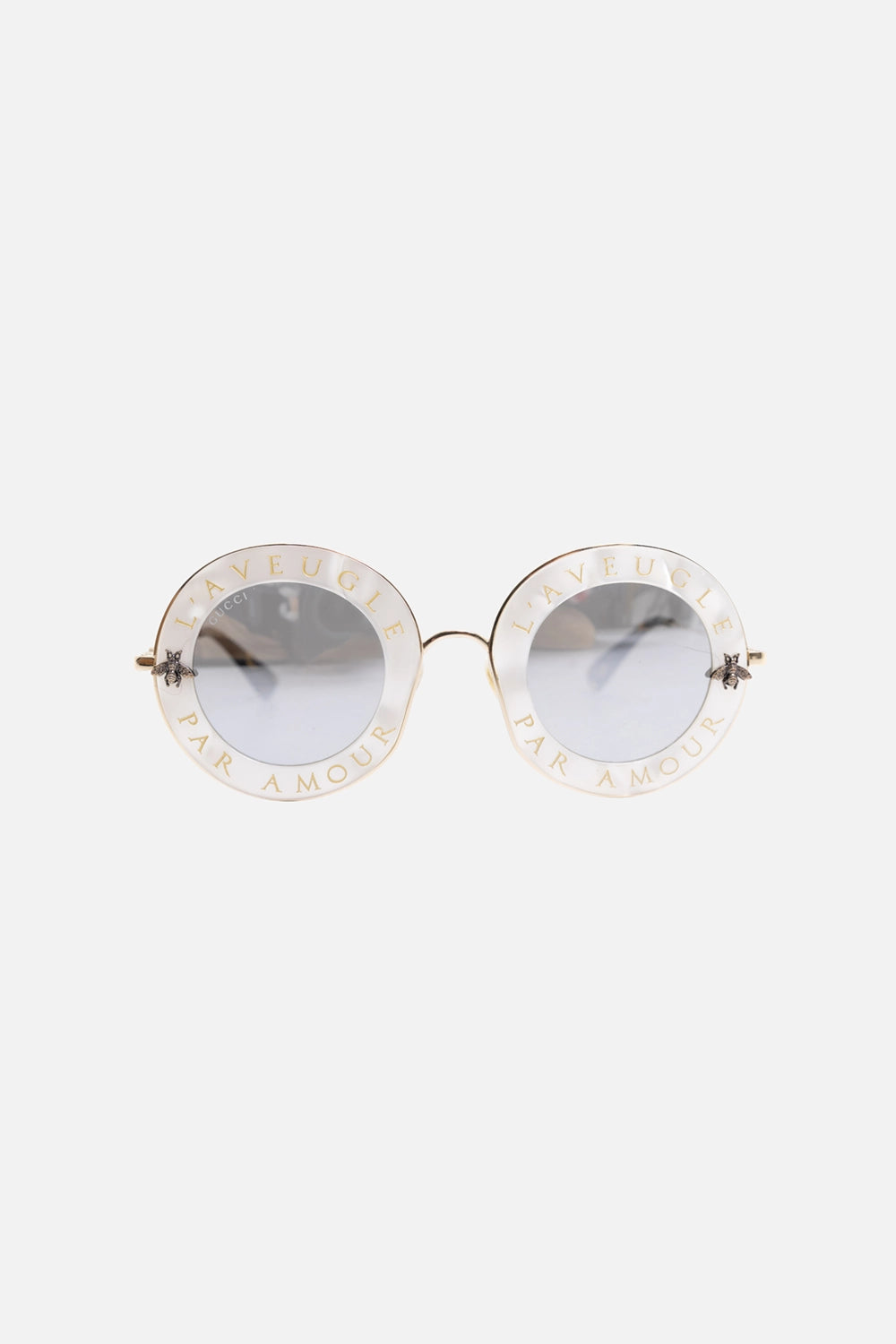 Pre-owned Gucci sunglasses in pearl white, front view, L’AVEUGLE PAR AMOUR lettering around rims