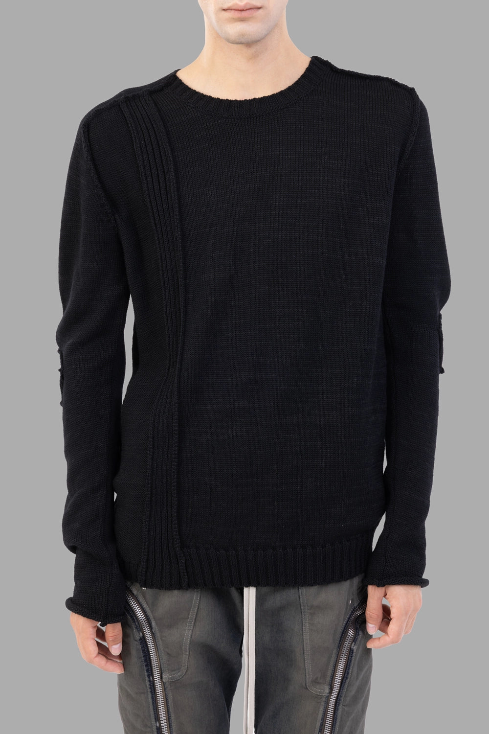 Masnada black sweater, front view, vertical rib panel with external seams