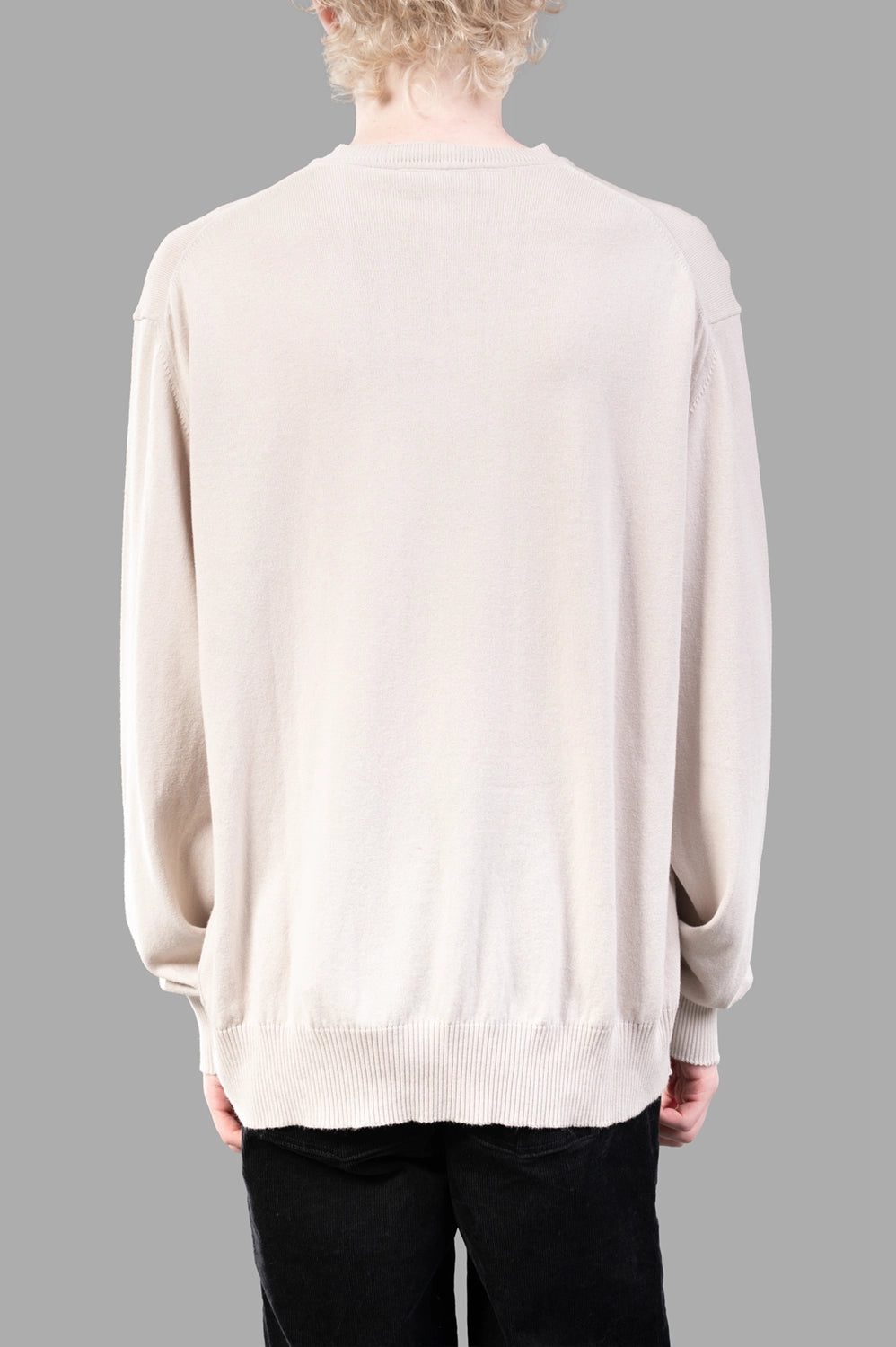Vivienne Westwood sweater in dusty white, back view, clean back and ribbed hem