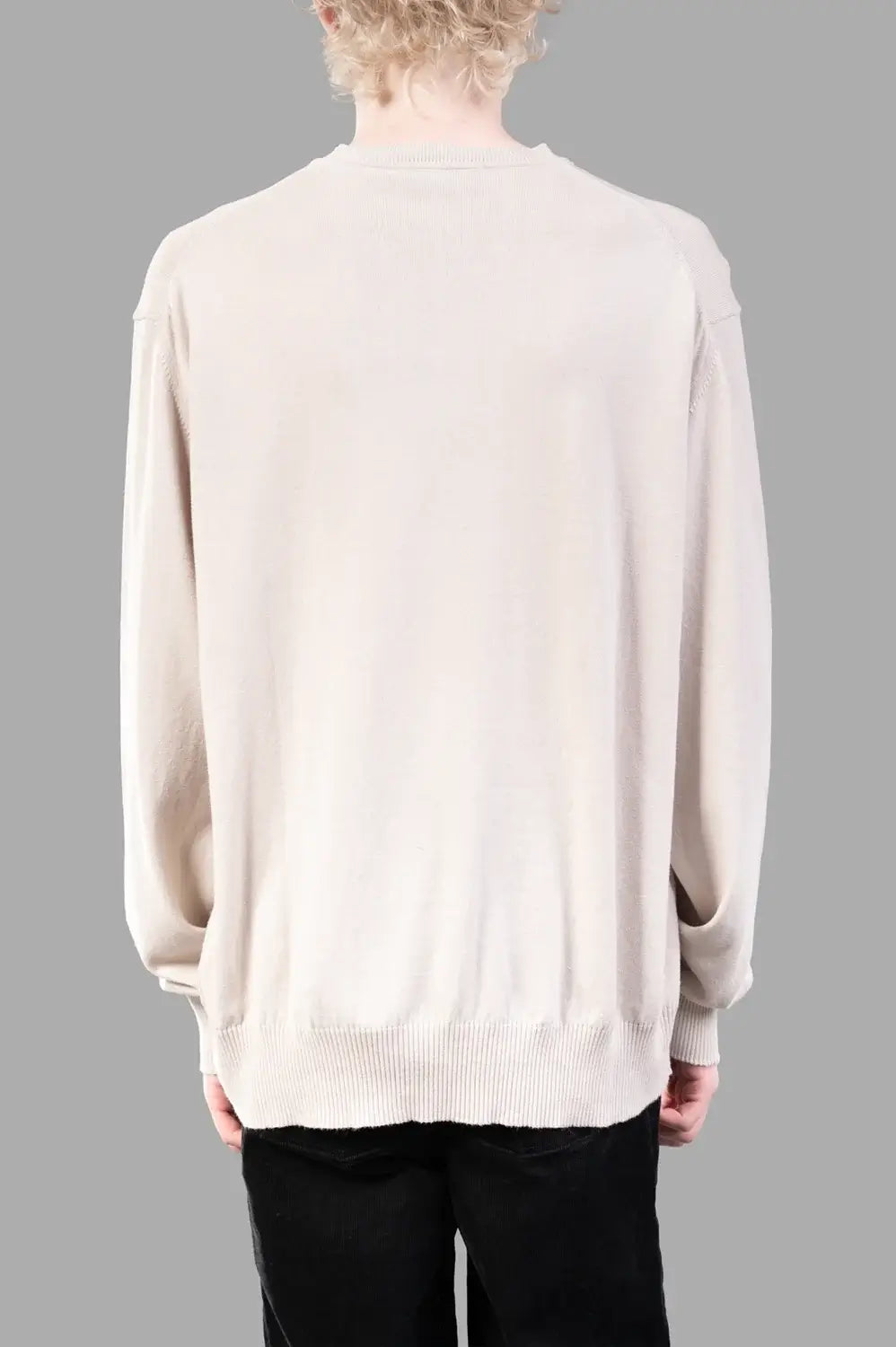 Vivienne Westwood sweater in dusty white, back view, clean back and ribbed hem