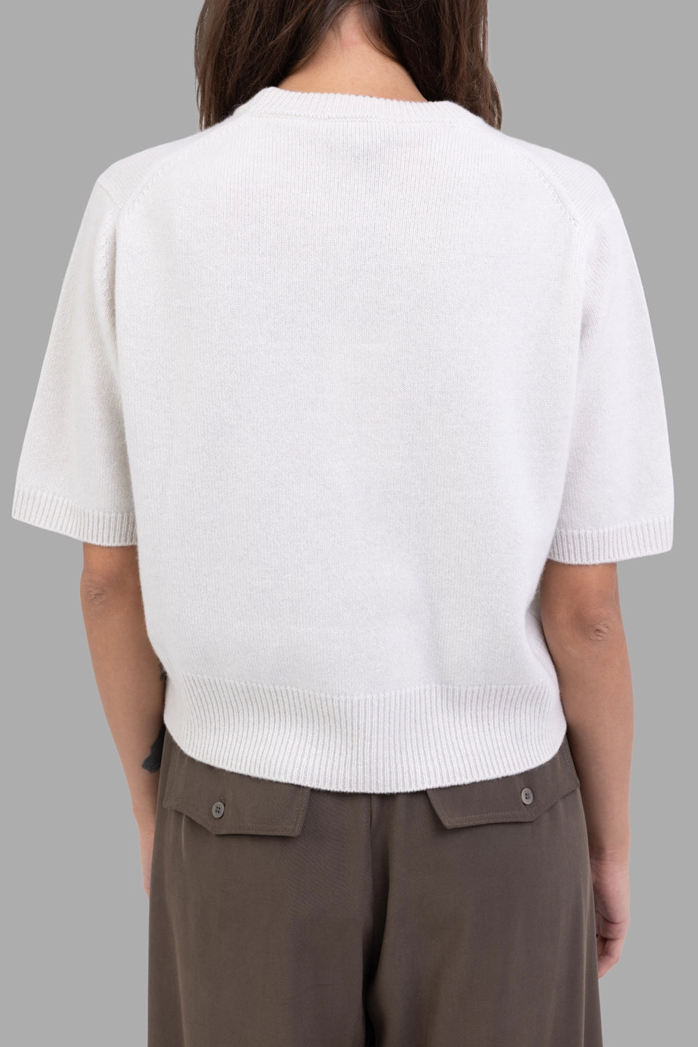Gentry Portofino women knit top in Stucco, back view, clean back and wide rib hem.