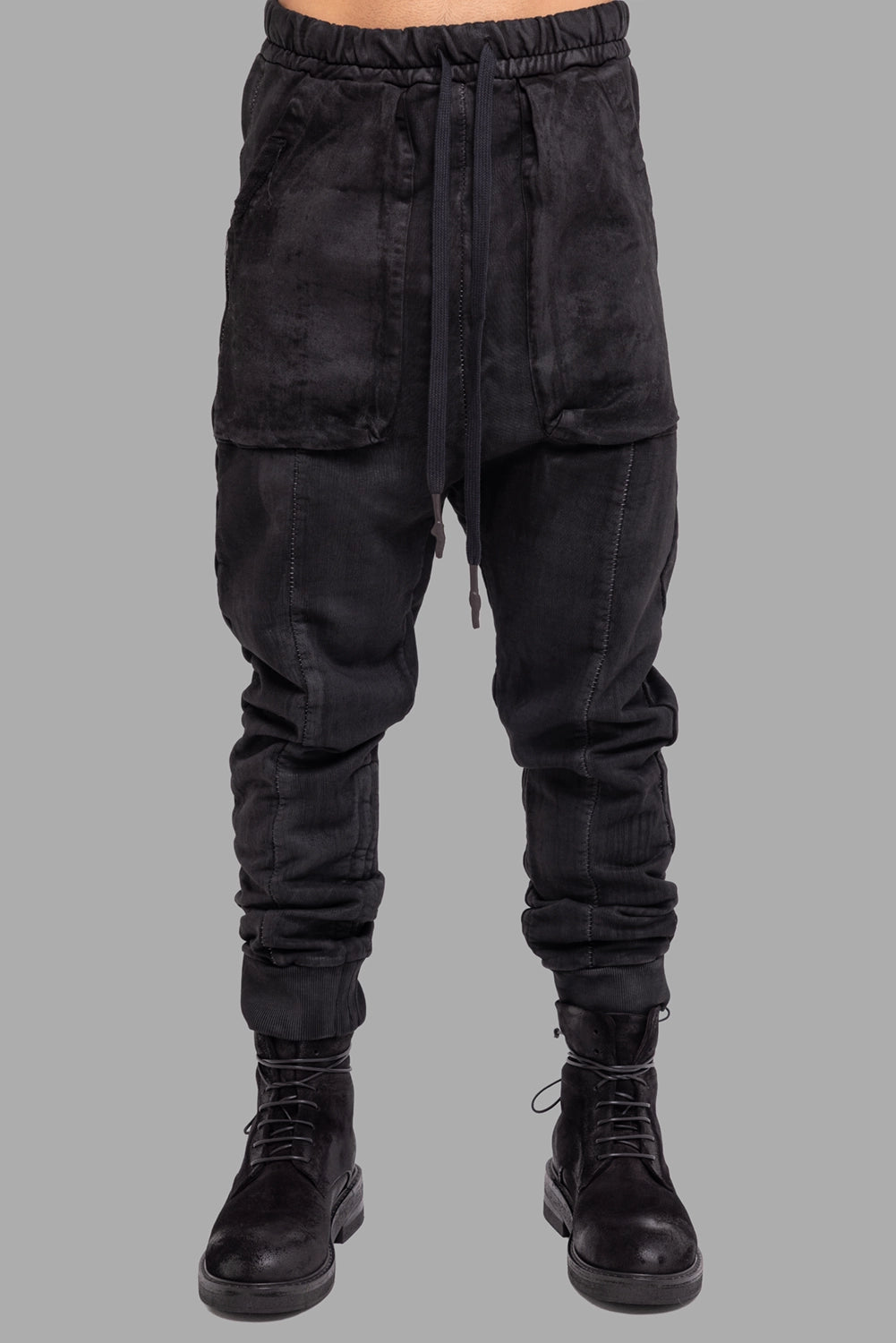 MD75 men’s coated sweatpants in black, front view, drop crotch and elastic waist with long drawcords.