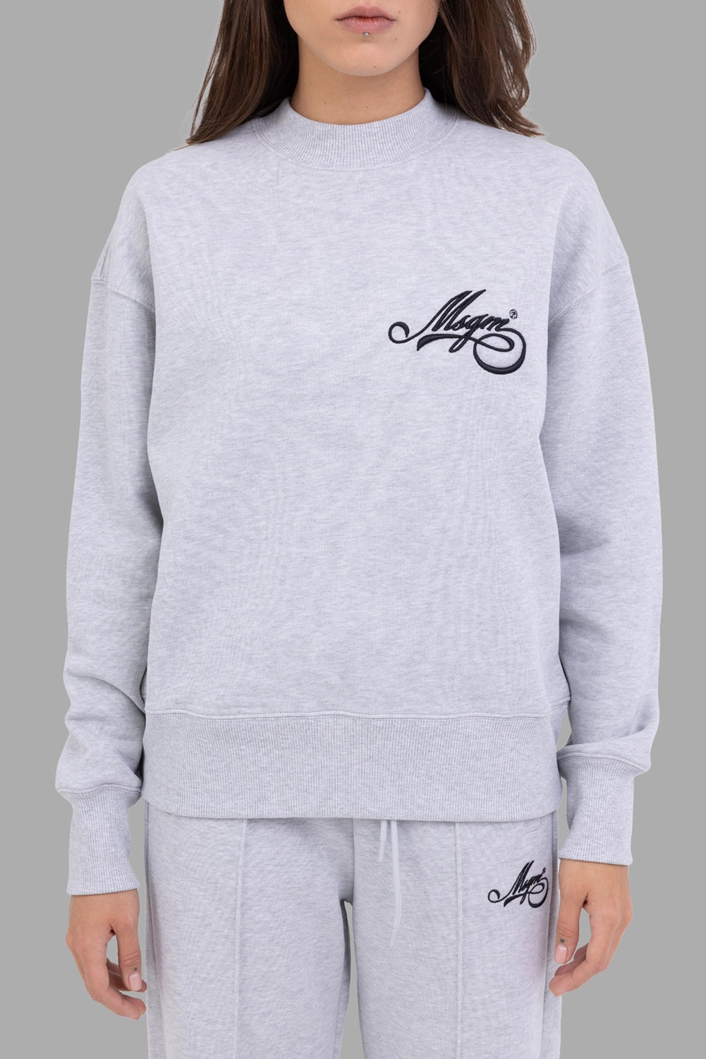 MSGM women's sweatshirt in grey melange, front view, chest cursive logo embroidery and wide ribbed hem