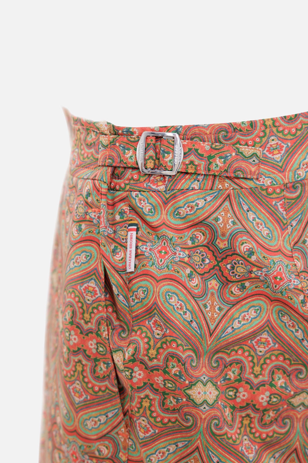 Orlebar Brown men's swim shorts in Vermillion, hardware close-up with silver side fastener and logo tab