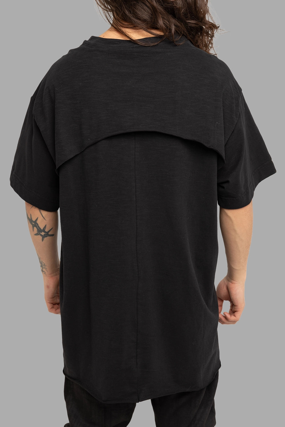Justin Gall men’s T-shirt in black, back view, layered back yoke and center seam.